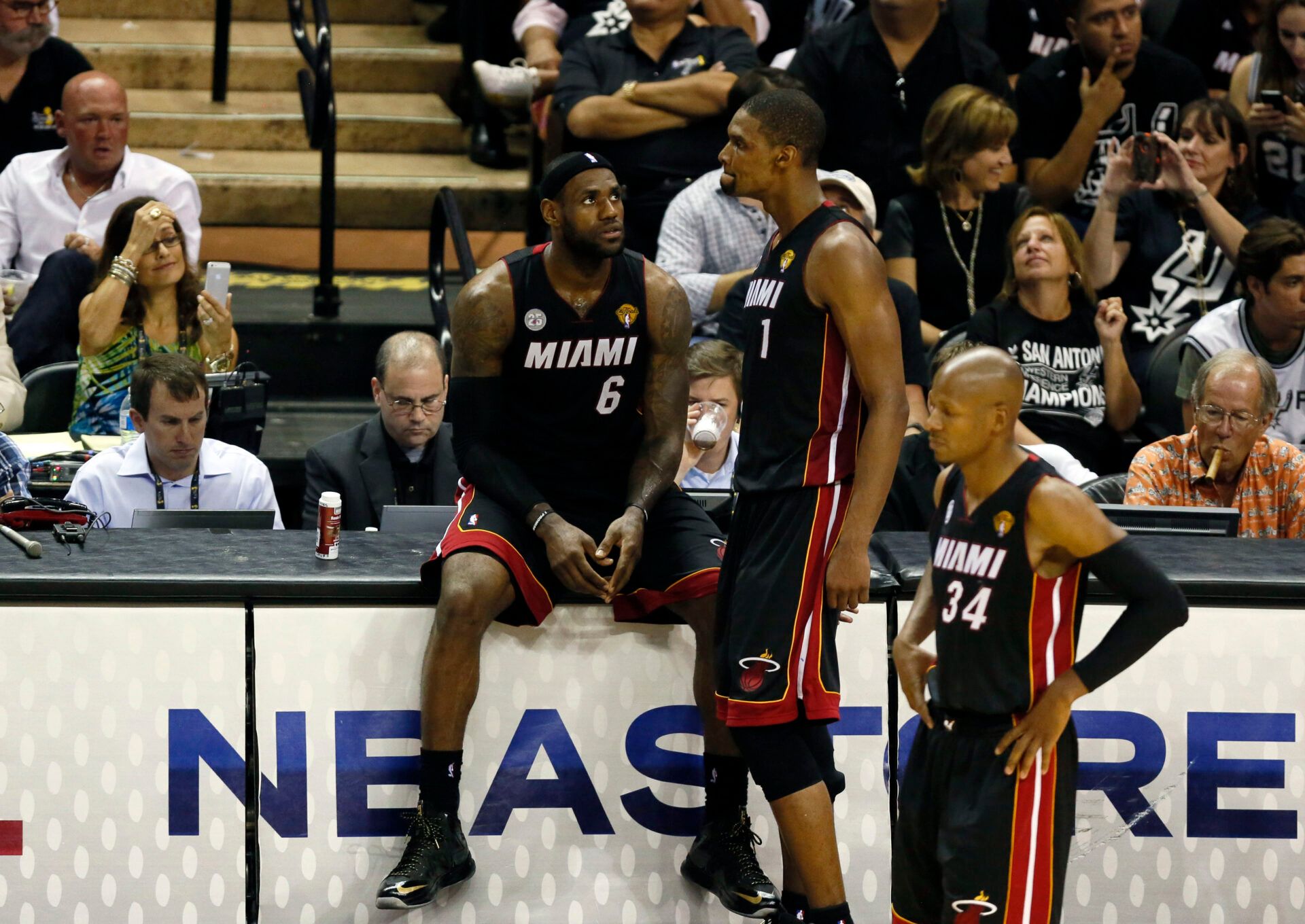 Miami Heat small forward LeBron James (6) and center Chris Bosh (1) and shooting guard Ray Allen (34) react during the fourth quarter of game five in the 2013 NBA Finals against the San Antonio Spurs at the AT&T Center.