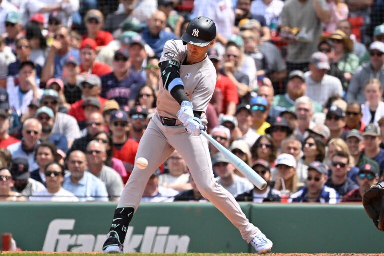 New York Yankees right fielder Cody Bellinger (35) makes a catch hits a single against the Boston Red Sox during the third inning at Fenway Park.
