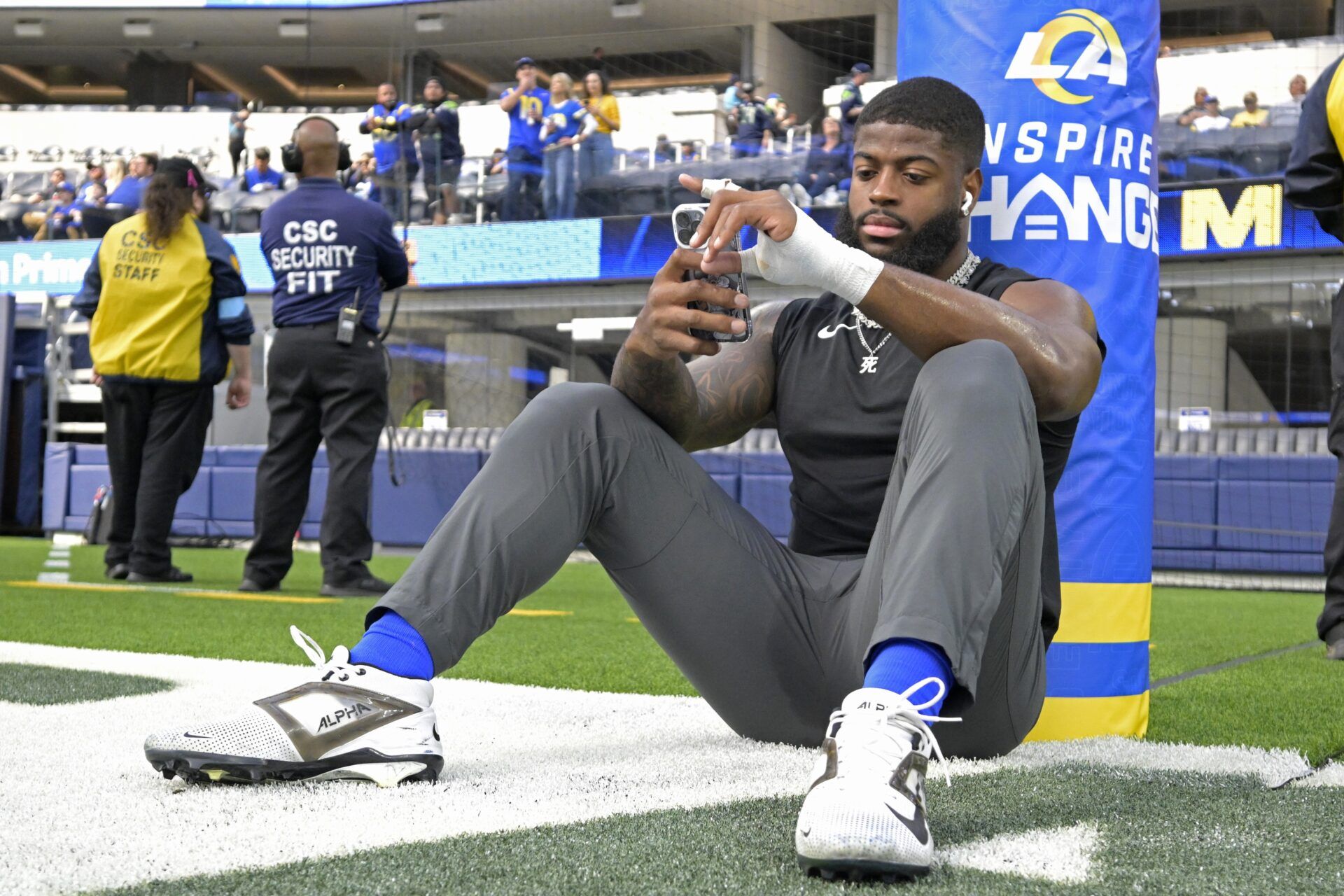 Los Angeles Rams linebacker Jared Verse (8) sits on the field prior to the game against the Seattle Seahawks at SoFi Stadium.