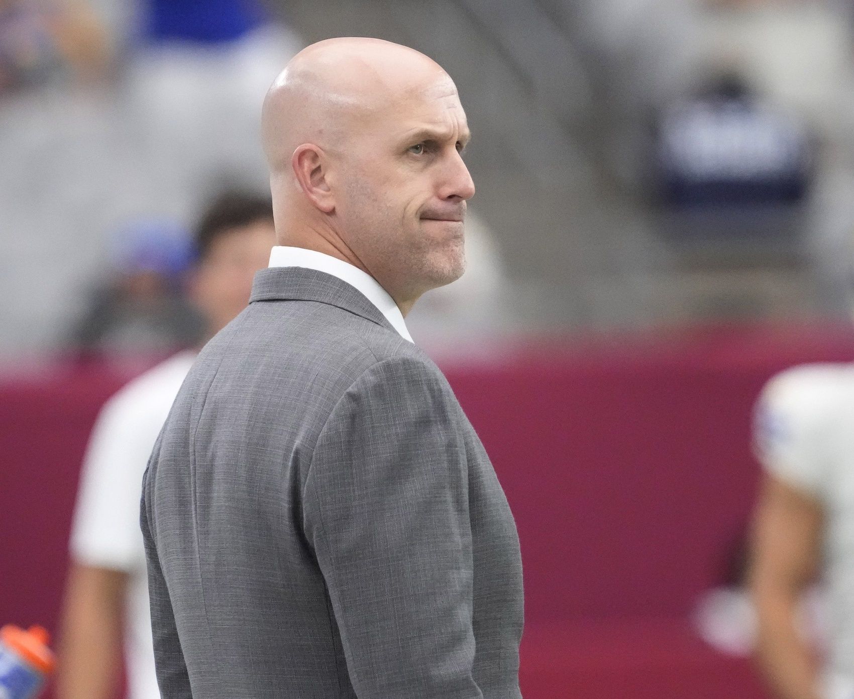 Arizona Cardinals general manager Monti Ossenfort watches his team warm up before playing against the Los Angeles Rams at State Farm Stadium on Sept. 15, 2024.