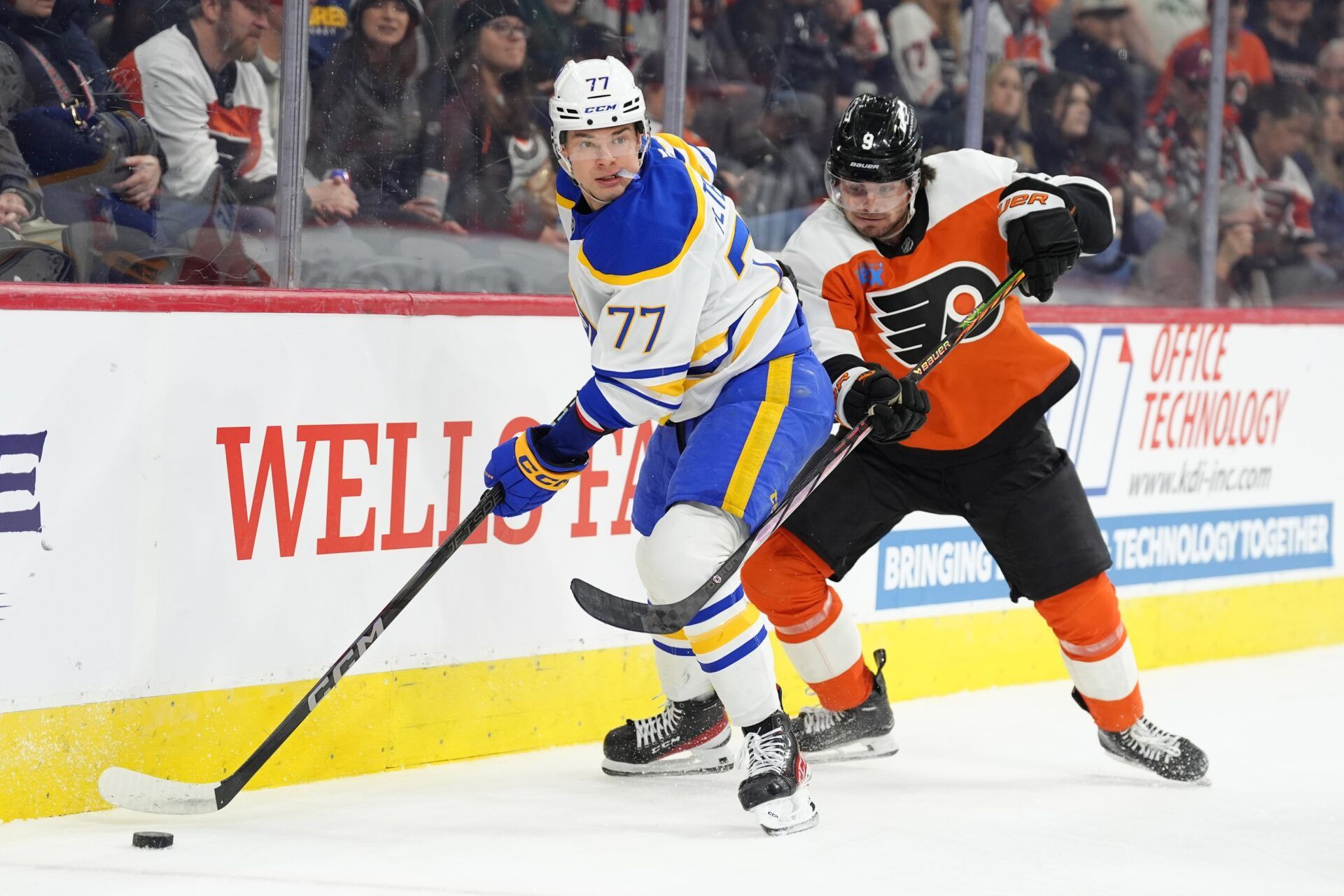 Buffalo Sabres right wing JJ Peterka (77) controls the puck against Philadelphia Flyers defenseman Jamie Drysdale (9) in the first period at Wells Fargo Center.