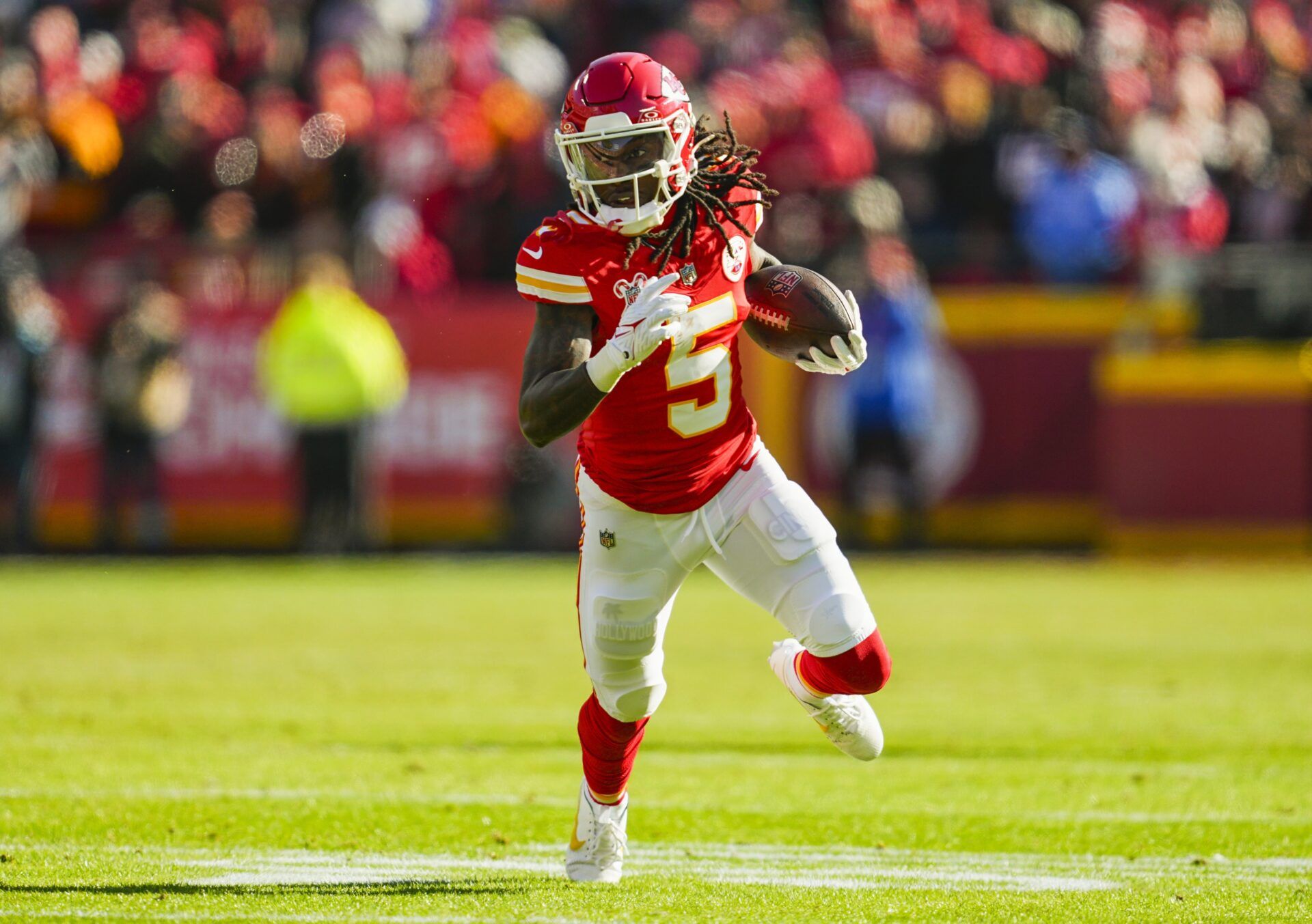 Kansas City Chiefs wide receiver Hollywood Brown (5) runs with the ball during the first half against the Houston Texans at GEHA Field at Arrowhead Stadium.
