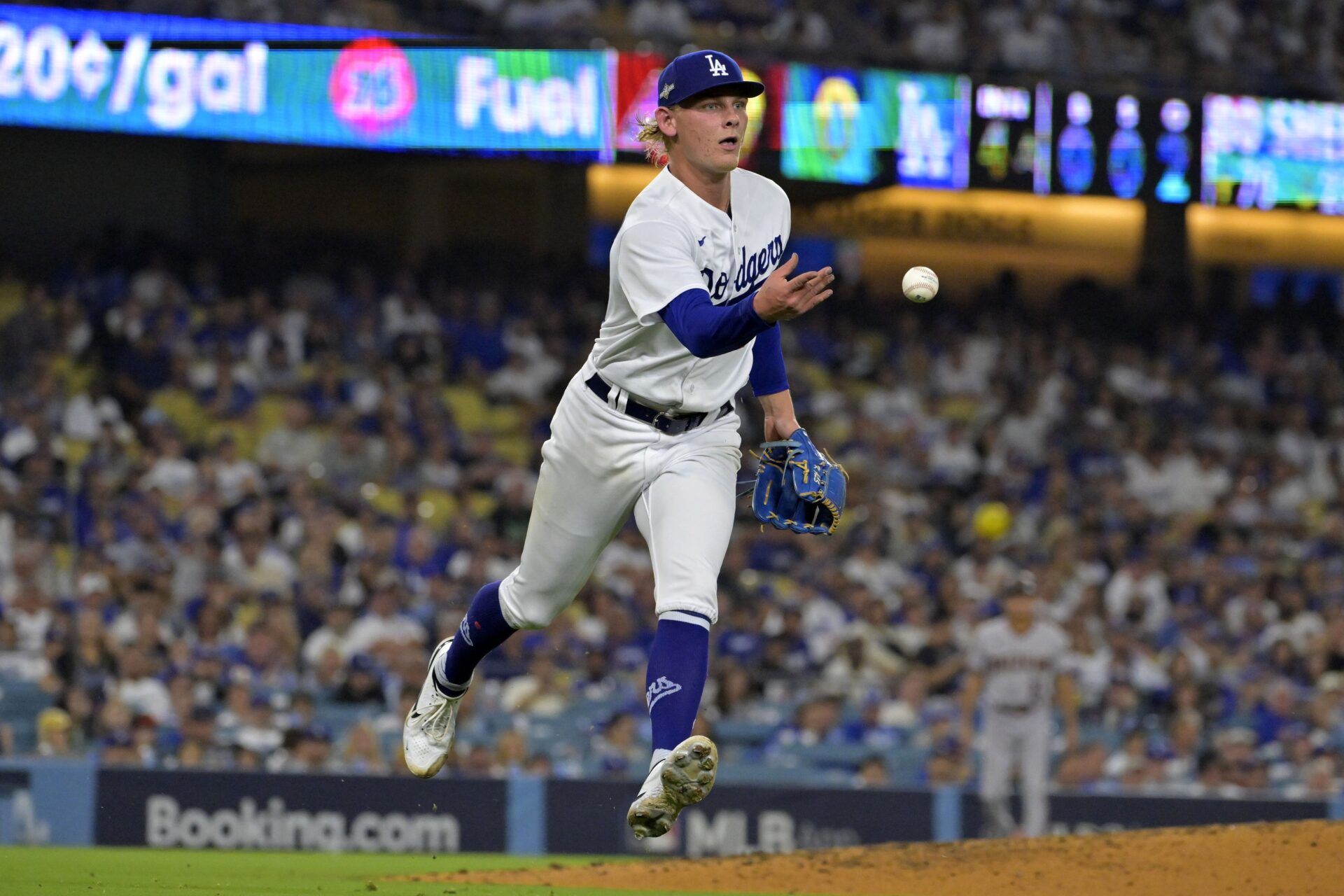 Los Angeles Dodgers starting pitcher Emmet Sheehan (80) makes a throw to first base against the Arizona Diamondbacks during the third inning for game one of the NLDS for the 2023 MLB playoffs at Dodger Stadium.