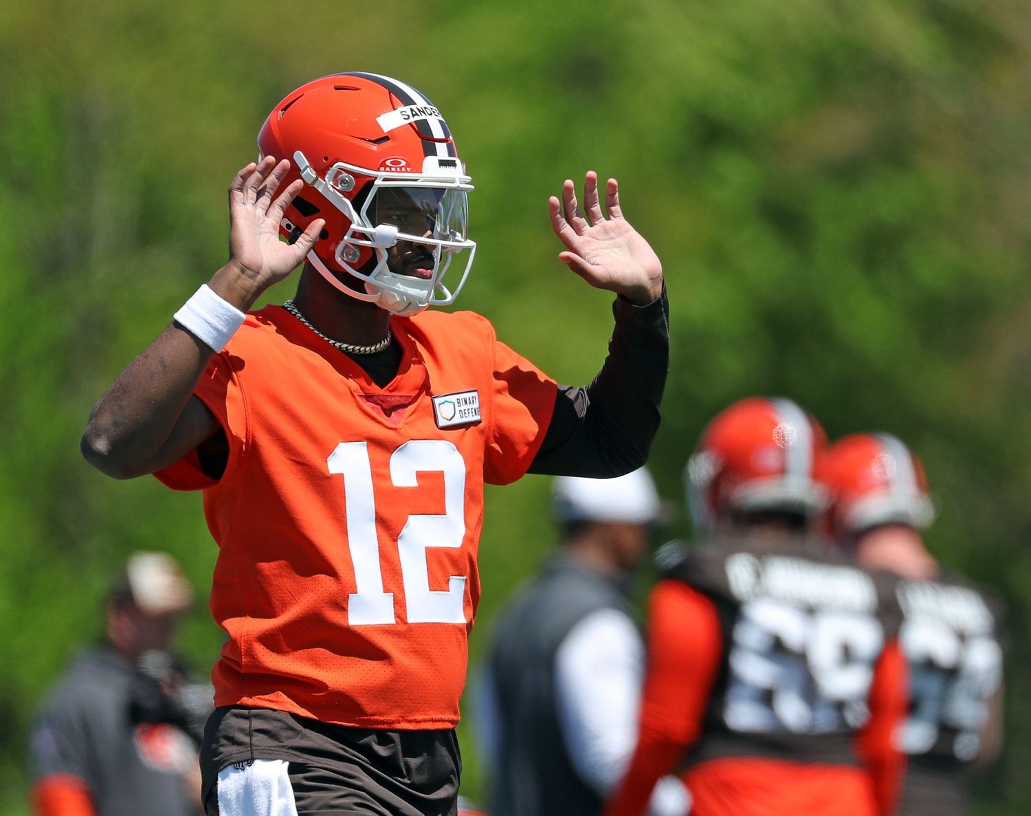 Cleveland Browns quarterback Shedeur Sanders gestures during rookie minicamp