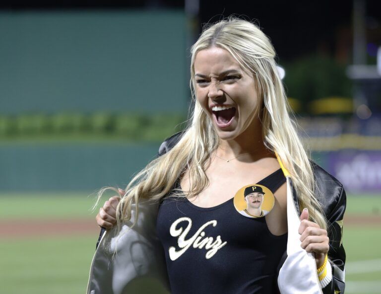 Louisiana State University gymnast Olivia Dunne reacts on the field after her boyfriend, Pittsburgh Pirates starting pitcher Paul Skenes (not pictured) made his major league debut against the Chicago Cubs at PNC Park. The Pirates won 10-8.
