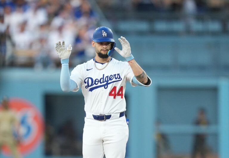 Los Angeles Dodgers center fielder Andy Pages (44) celebrates after hitting a double during the second inning against the San Diego Padres  at Dodger Stadium.
