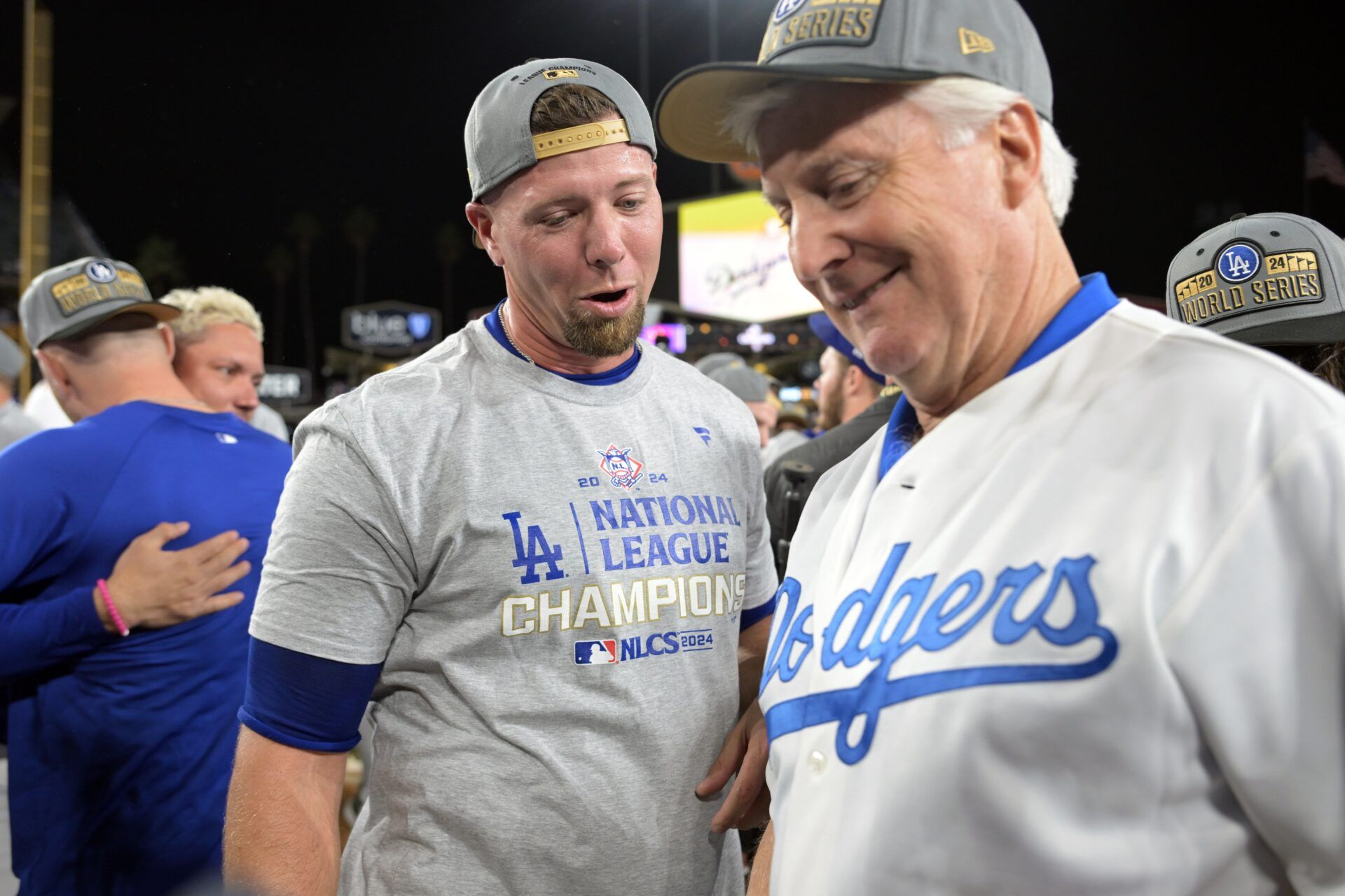 Los Angeles Dodgers pitcher Blake Treinen (49) celebrates with team owner Mark Walter on the field after defeating the New York Mets in game six of the NLCS for the 2024 MLB playoffs to advance to the World Series at Dodger Stadium.