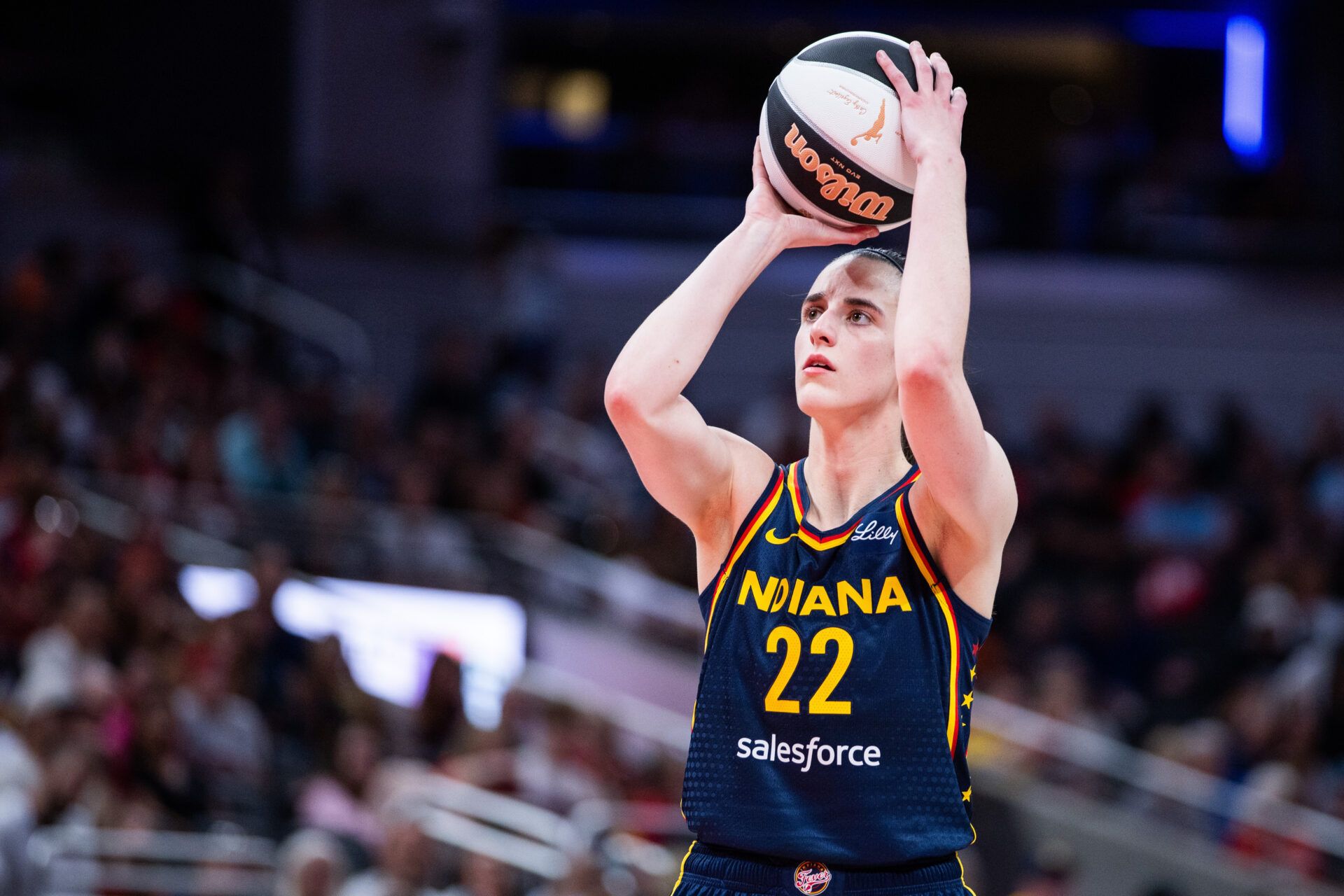 Indiana Fever guard Caitlin Clark (22) shoots the ball in the first half against the Connecticut Sun at Gainbridge Fieldhouse.