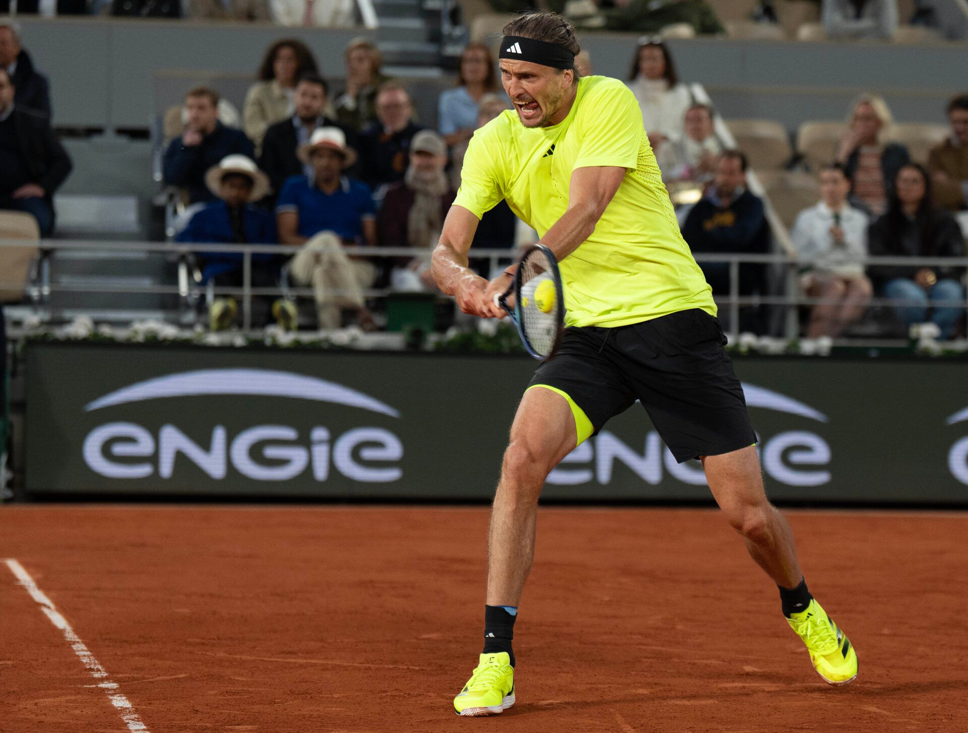 Alexander Zverev of Germany returns a shot during his match against Novak Djokovic of Serbia on day 11 at Roland Garros Stadium.