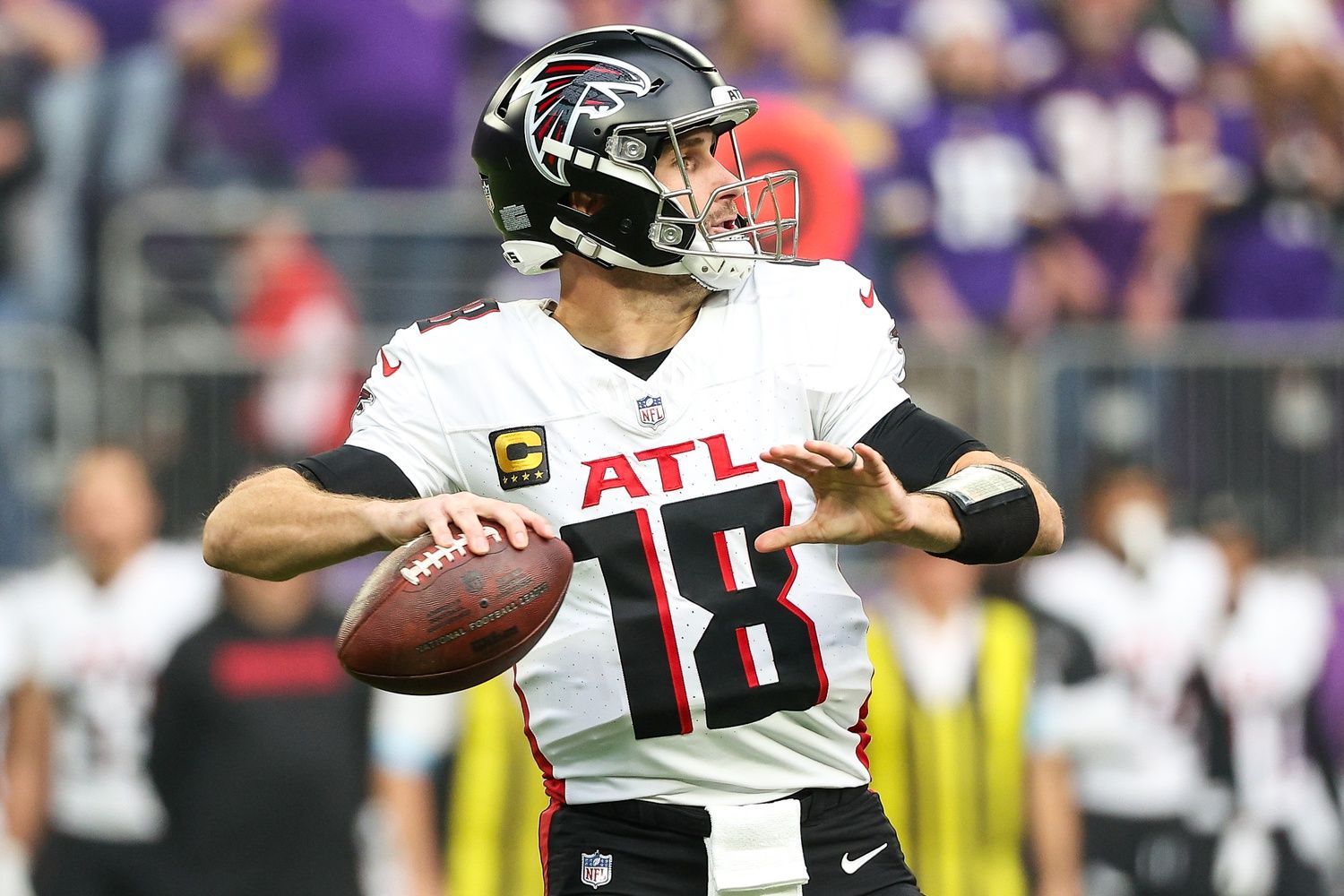 Atlanta Falcons quarterback Kirk Cousins (18) throws the ball against the Minnesota Vikings during the first quarter at U.S. Bank Stadium.