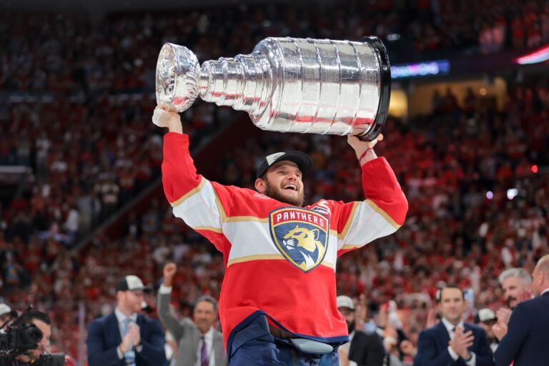 Florida Panthers center Aleksander Barkov (16) hoists the Stanley Cup after winning game six of the 2025 Stanley Cup Final against the Edmonton Oilers at Amerant Bank Arena.