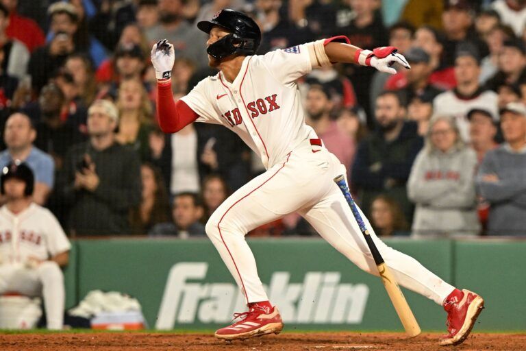 Boston Red Sox second baseman Kristian Campbell (28) hits a RBI against the Tampa Bay Rays during the ninth inning at Fenway Park.