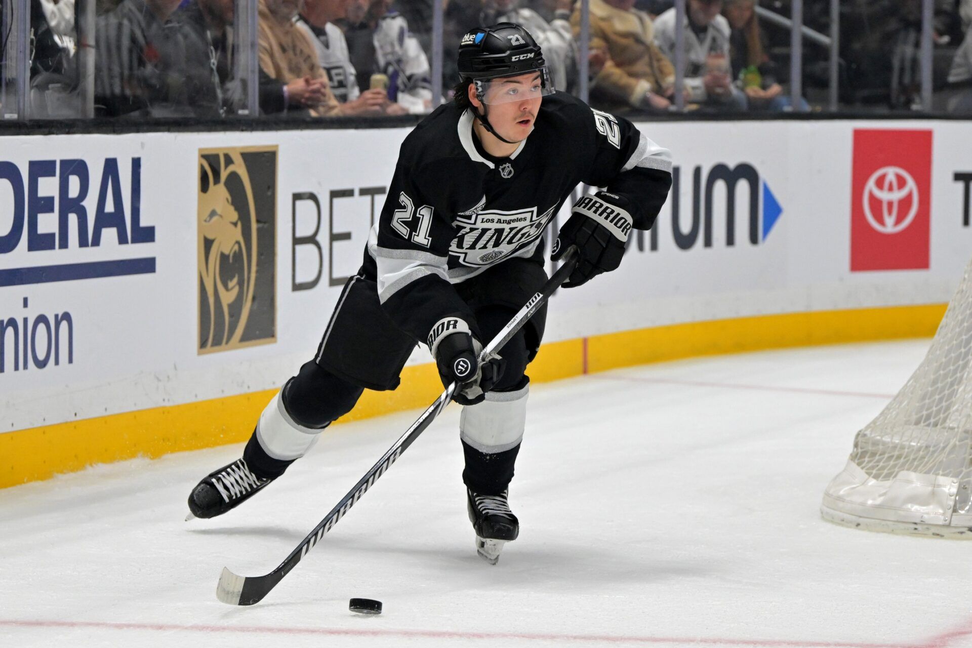 Los Angeles Kings defenseman Jordan Spence (21) handles the puck during game 2 of the 2025 Stanley Cup Playoffs against the Edmonton Oilers at Crypto.com Arena.