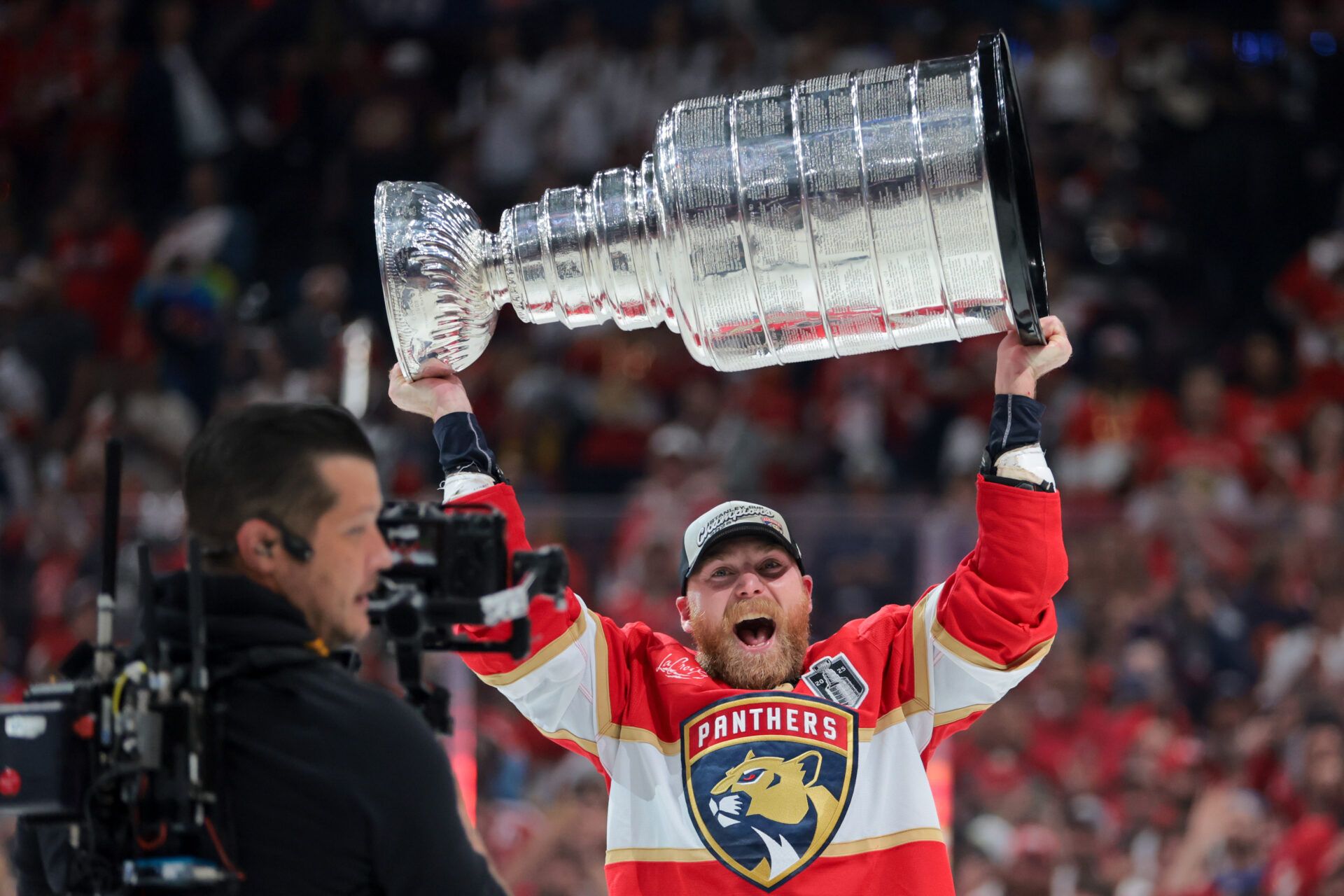 Florida Panthers center Sam Bennett (9) hoists the Stanley Cup after winning game six of the 2025 Stanley Cup Final against the Edmonton Oilers at Amerant Bank Arena.