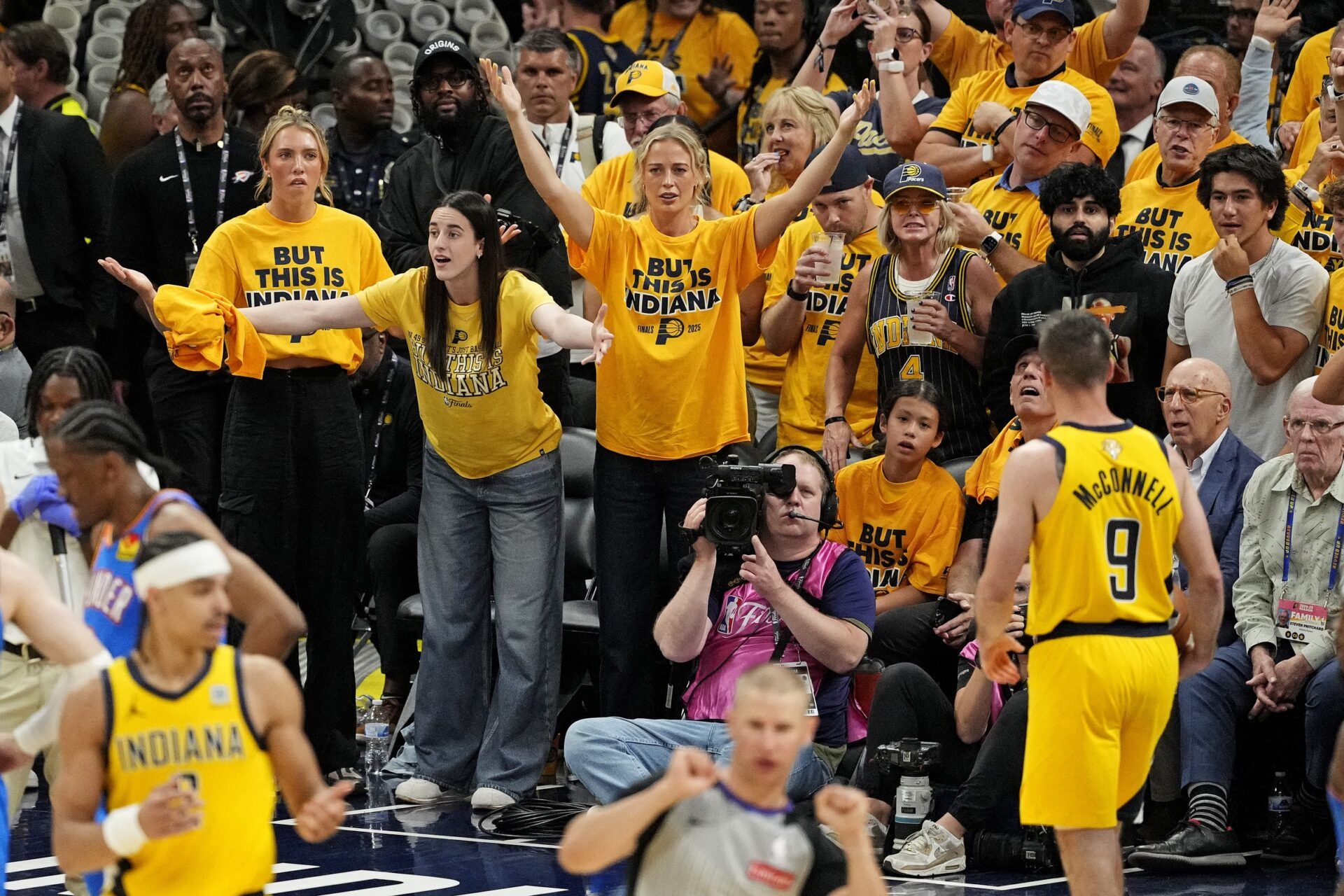 Indiana Fever player Caitlin Clark reacts to a play from the crowd during the fourth quarter of game three of the 2025 NBA Finals between the Indiana Pacers and the Oklahoma City Thunder at Gainbridge Fieldhouse.