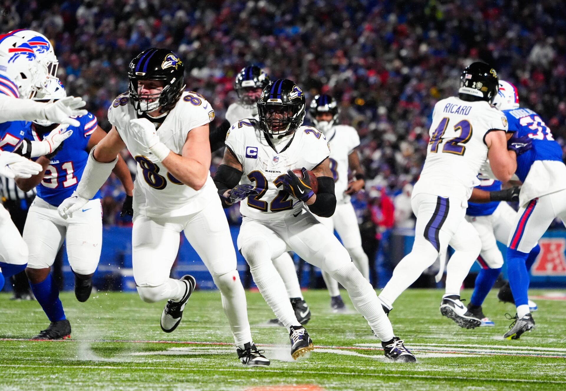Baltimore Ravens running back Derrick Henry (22) runs the ball during the third quarter against the Buffalo Bills in a 2025 AFC divisional round game at Highmark Stadium.