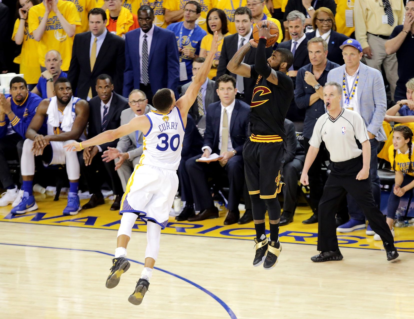 Cleveland Cavaliers guard Kyrie Irving (2) shoots the the game winning shot during the fourth quarter against Golden State Warriors guard Stephen Curry (30) in game seven of the NBA Finals at Oracle Arena.