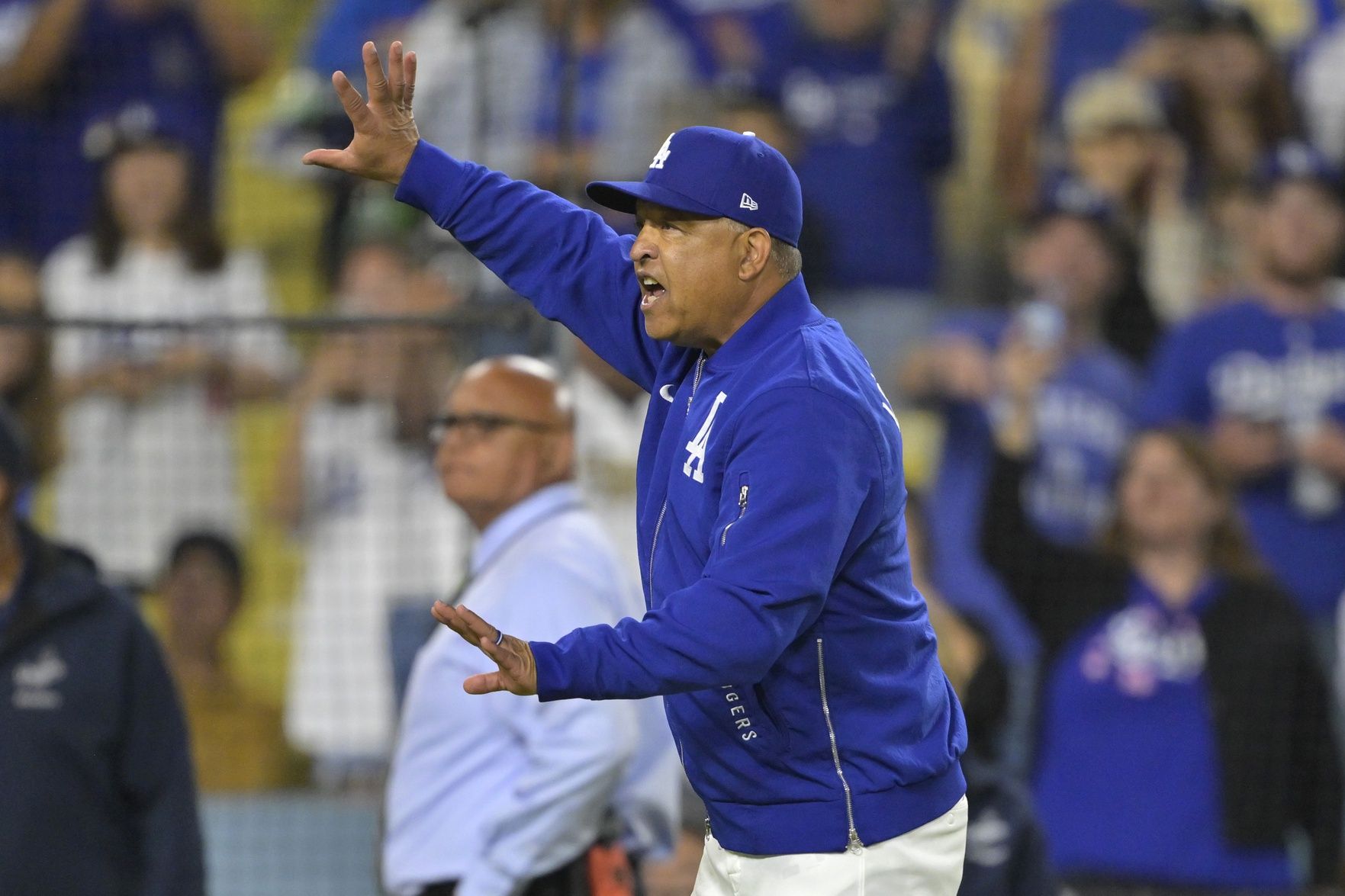 Los Angeles Dodgers manager Dave Roberts (30) yells at San Diego Padres manager Mike Shildt (8) after benches cleared in the eighth inning at Dodger Stadium.