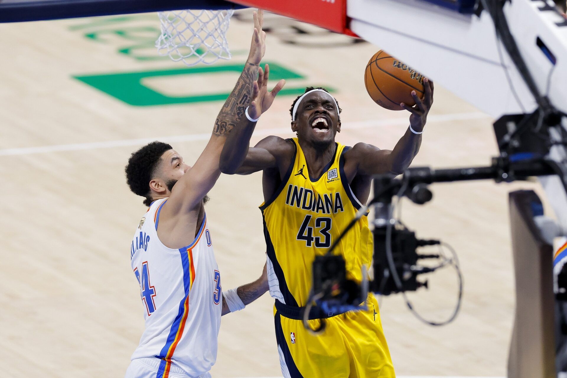Indiana Pacers forward Pascal Siakam (43) drives to the basket past Oklahoma City Thunder forward Kenrich Williams (34) during the fourth quarter in game five of the 2025 NBA Finals at Paycom Center.