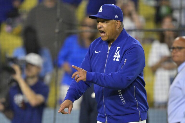 Los Angeles Dodgers manager Dave Roberts (30) yells at San Diego Padres manager Mike Shildt (8) after benches cleared in the eighth inning at Dodger Stadium.