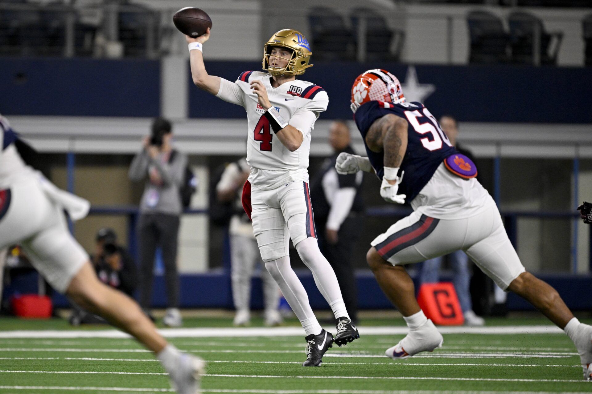 West quarterback Ethan Garbers of UCLA (4) passes the ball against the West during the second half at AT&T Stadium.