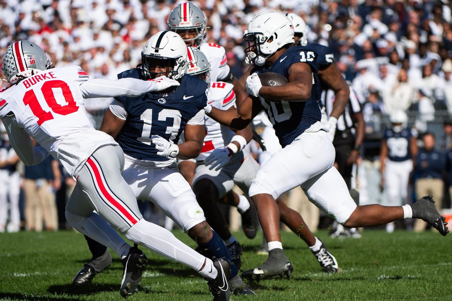 Penn State's Kaytron Allen (13) blocks for fellow running back Nick Singleton (10) in the first half of an NCAA football game against Ohio State, Saturday, Nov. 2, 2024, in State College, Pa.