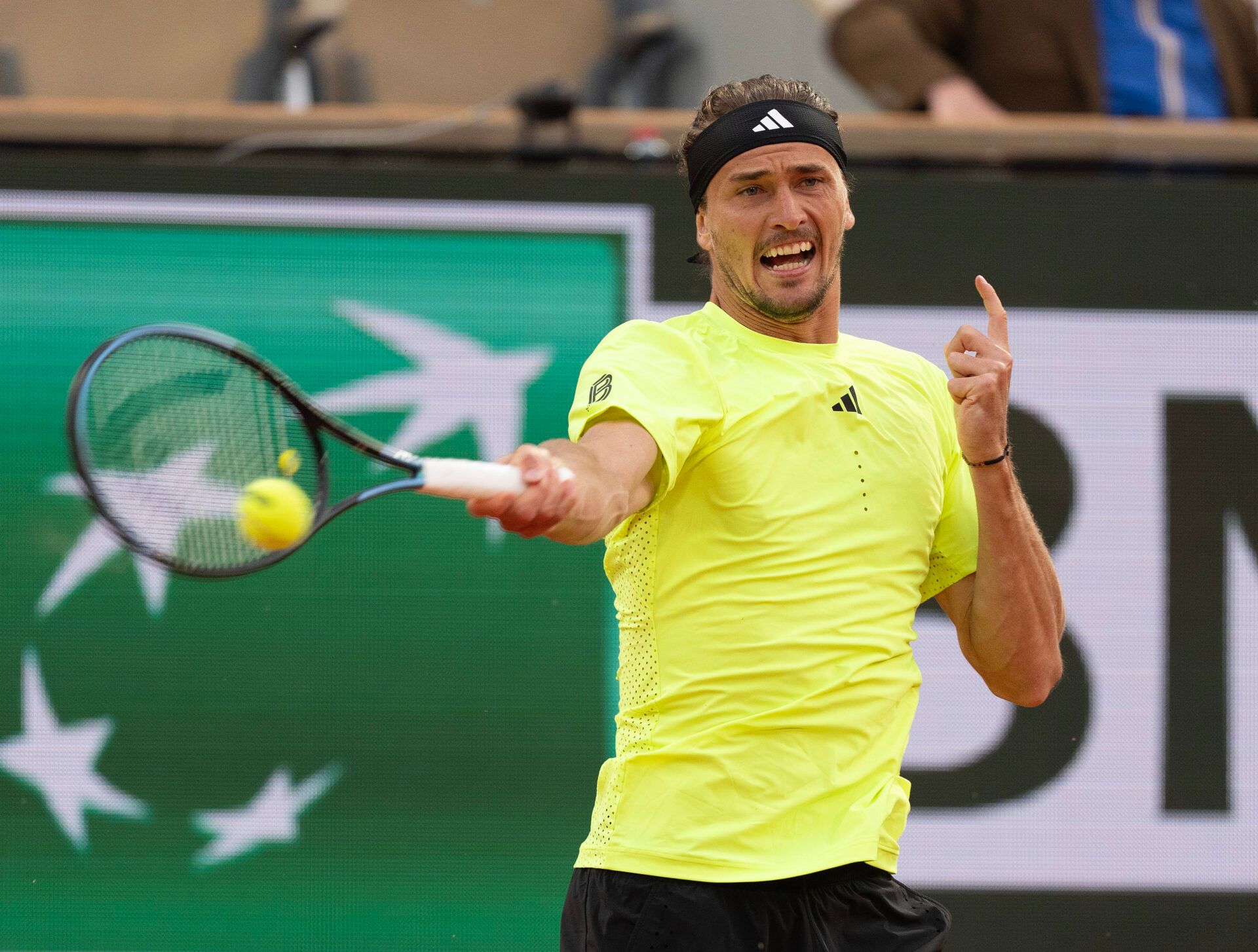Alexander Zverev of Germany returns a shot during his match against Novak Djokovic of Serbia on day 11 at Roland Garros Stadium.