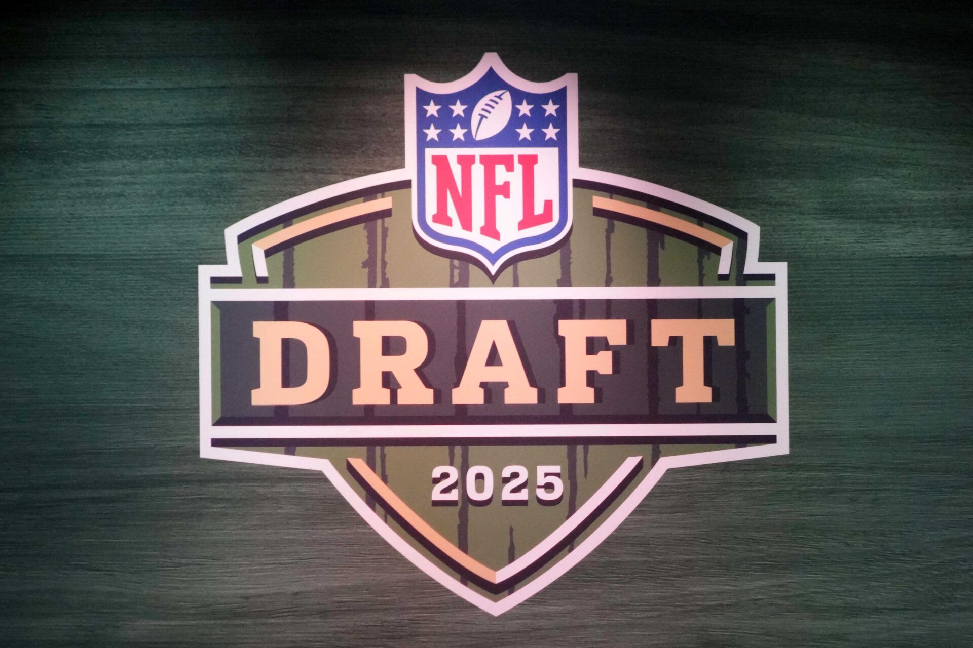 The 2025 NFL Draft logo on the main stage at Lambeau Field.