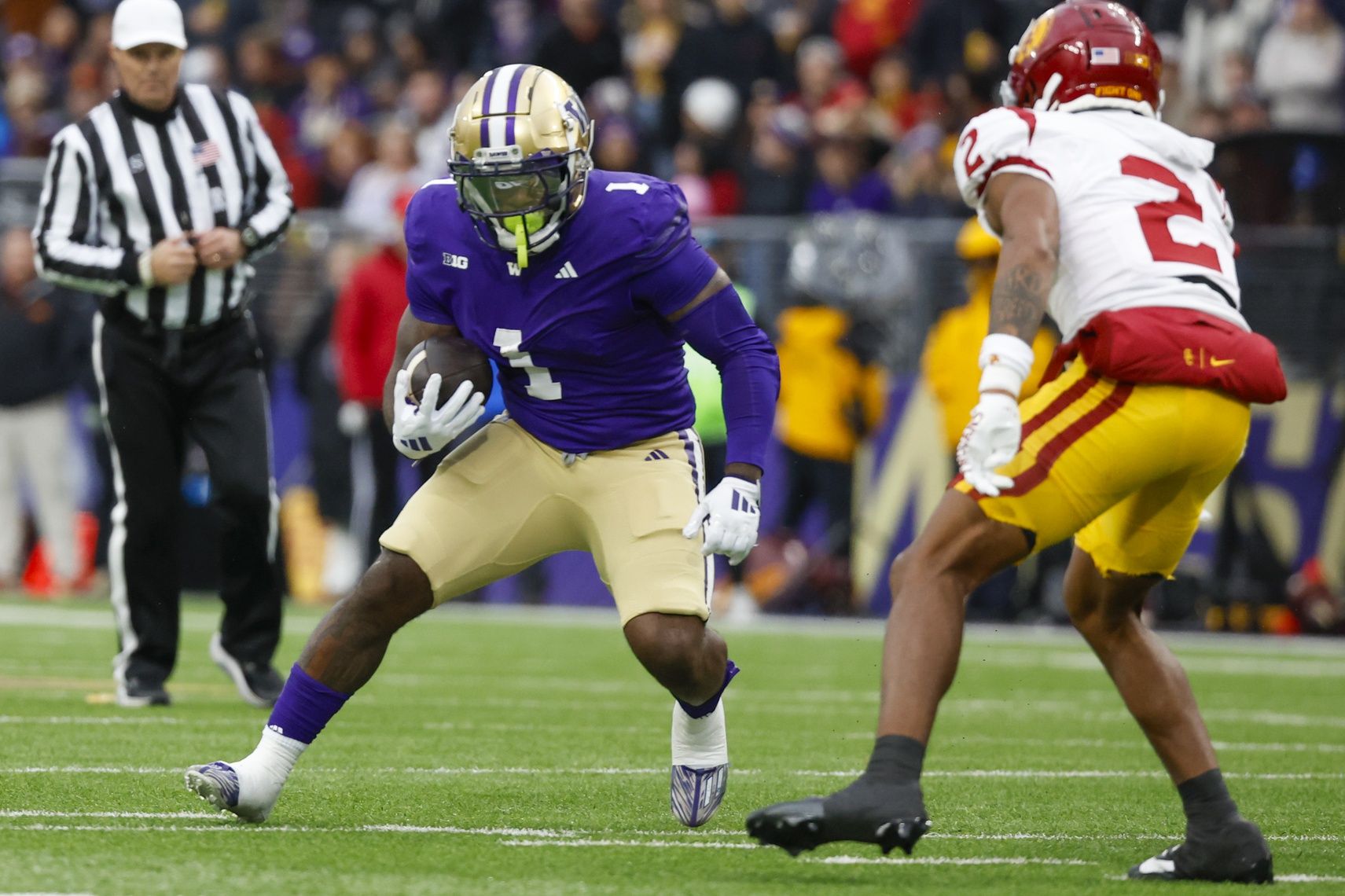 Washington Huskies running back Jonah Coleman (1) rushes against the USC Trojans during the first quarter at Alaska Airlines Field at Husky Stadium.