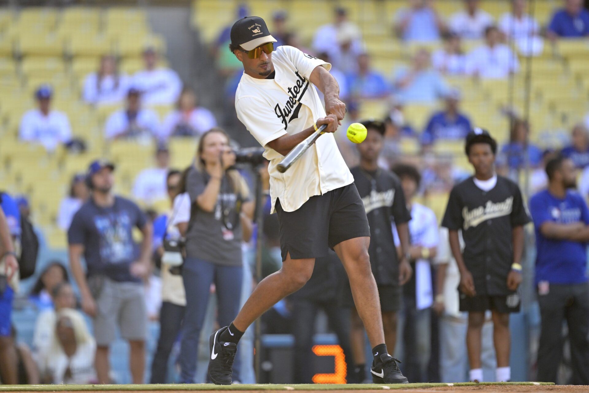 Green Bay Packers quarterback Jordan Love (10) participates in Los Angeles Dodgers shortstop Mookie Betts (50) celebrity softball game prior to the game agains the San Diego Padres at Dodger Stadium.