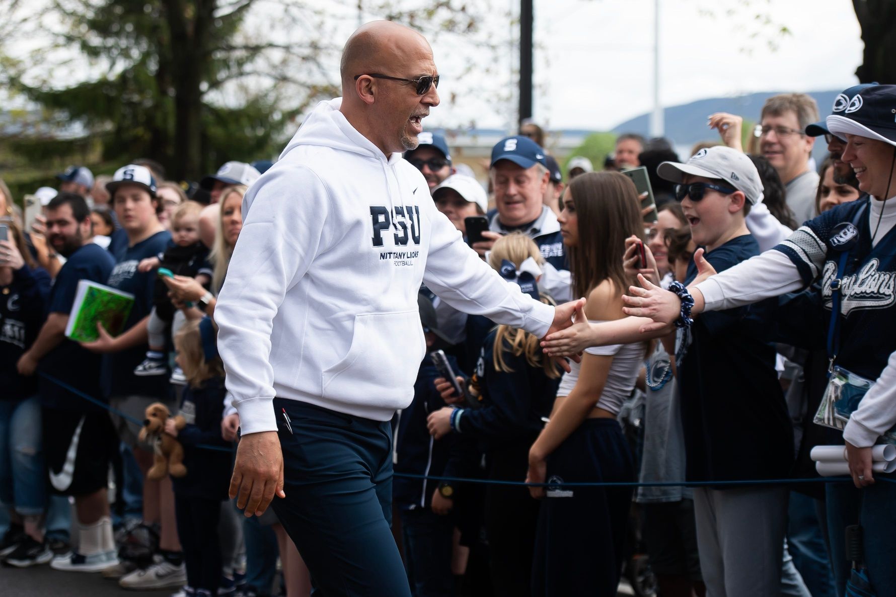 Penn State football head coach James Franklin greets fans on Curtin Road outside Beaver Stadium before the Blue-White game on Saturday, April 26, 2025, in State College.