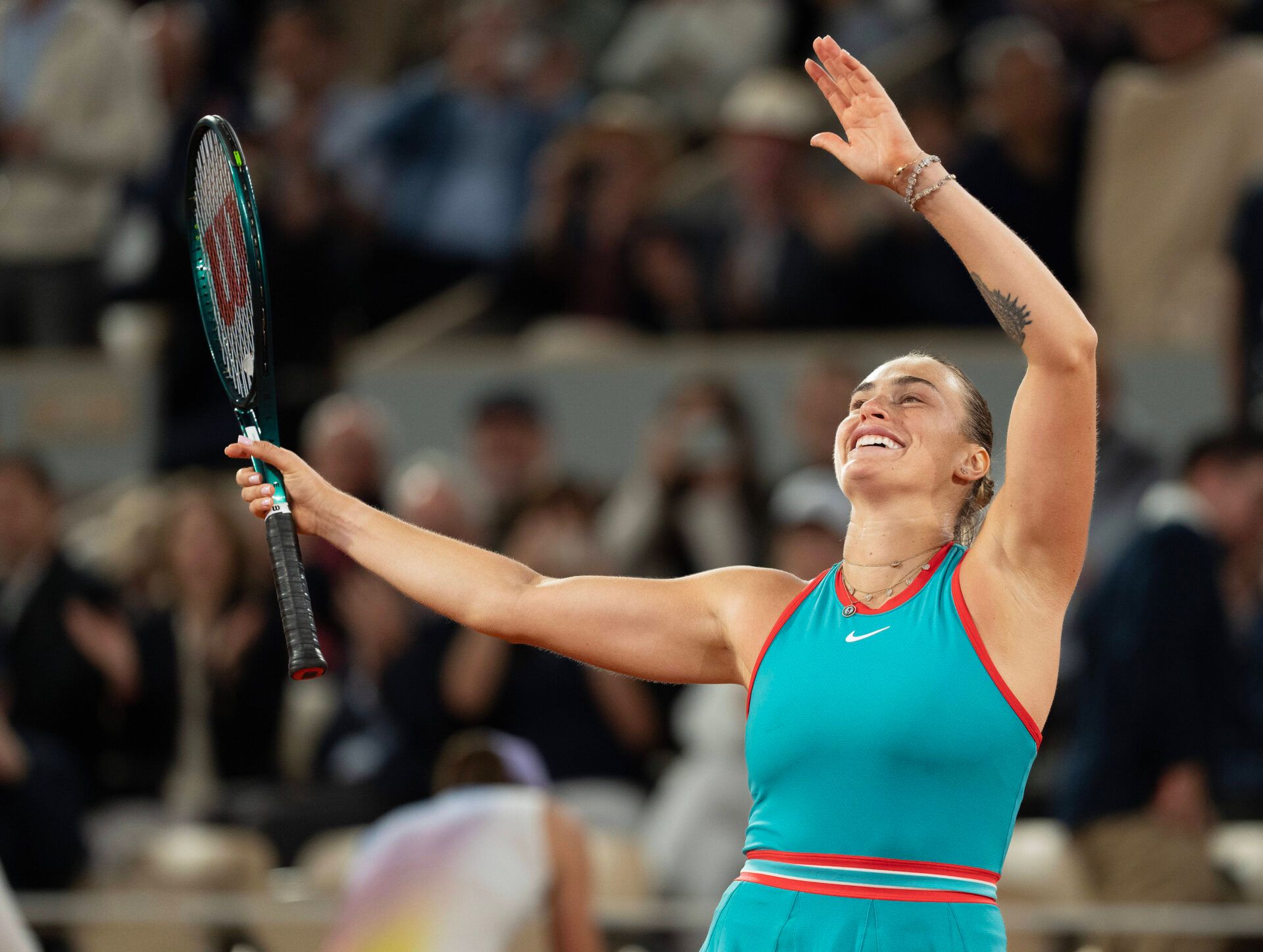 Aryna Sabalenka celebrates winning her match against Iga Swiatek of Poland on day 12 at Roland Garros Stadium.