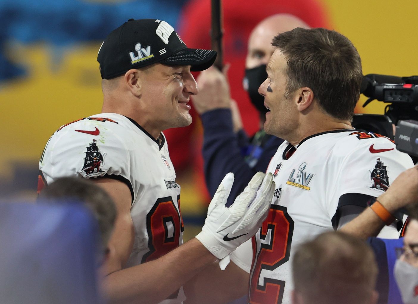 Tampa Bay Buccaneers quarterback Tom Brady (12) and tight end Rob Gronkowski (87) celebrate after defeating the Kansas City Chiefs in Super Bowl LV at Raymond James Stadium.
