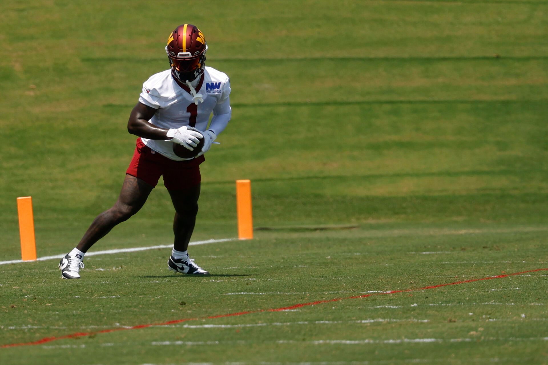 Washington Commanders wide receiver Deebo Samuel Sr. (1) catches a pass during drills on day one of minicamp at Commanders Park.