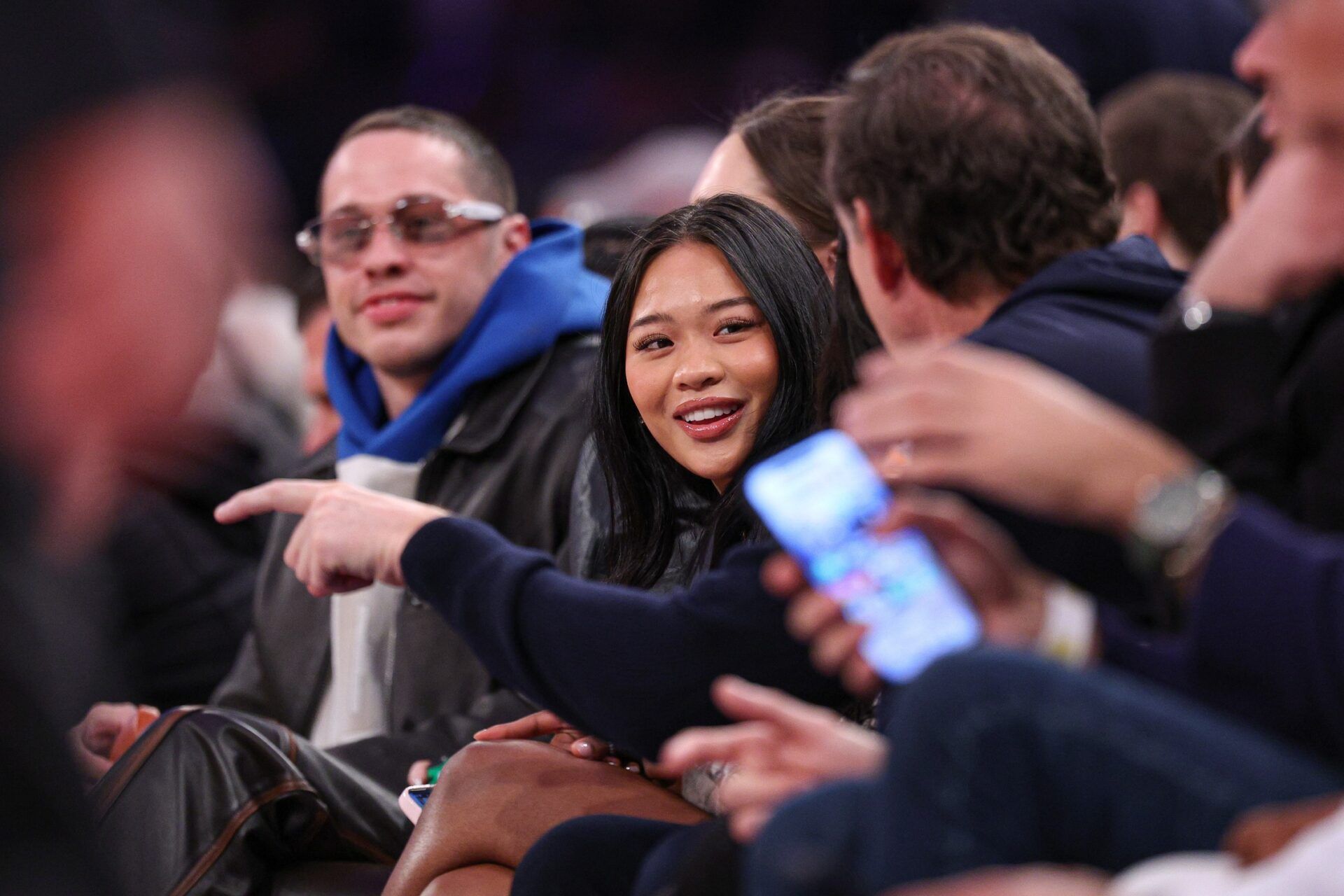 American olympic gold medal gymnast Sunisa Lee sits courtside 
during the second half of the NBA game between the New York Knicks and the Phoenix Suns at Madison Square Garden.
