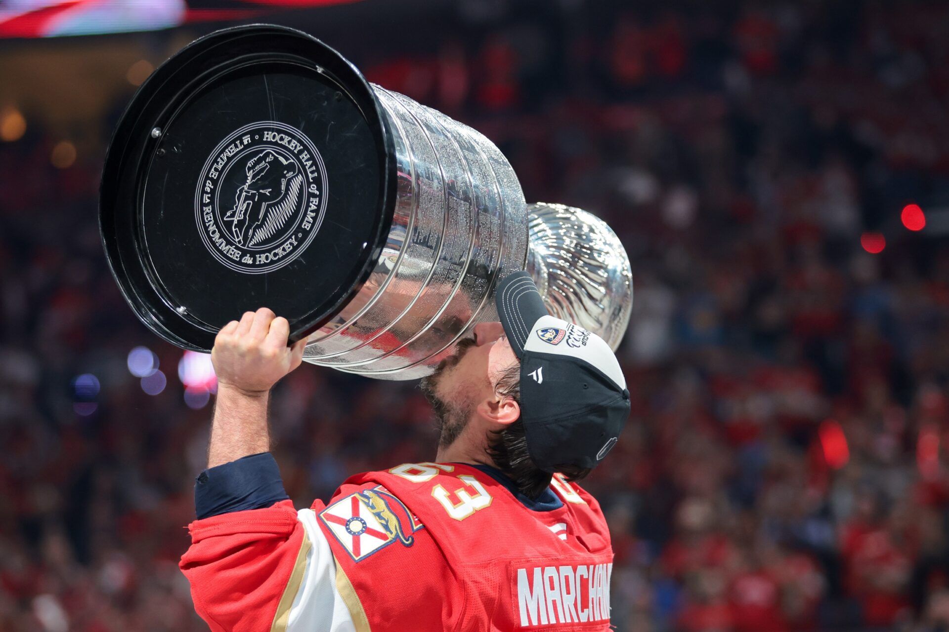 Florida Panthers center Brad Marchand (63) hoists the Stanley Cup after winning game six of the 2025 Stanley Cup Final against the Edmonton Oilers at Amerant Bank Arena.