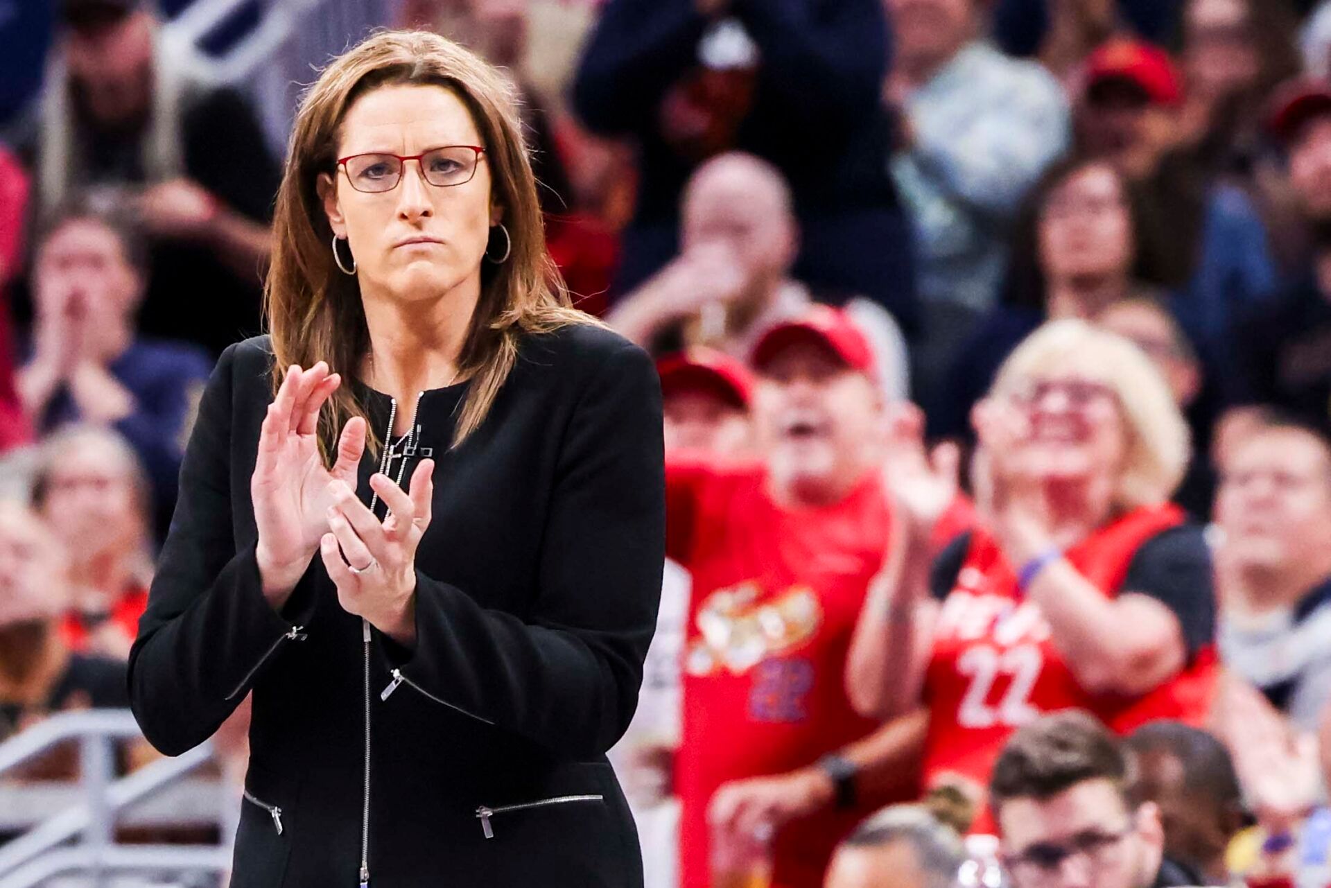 Indiana Fever head coach Stephanie White cheers for her team Saturday, June 14, 2025, during a game between the Indiana Fever and the New York Liberty at Gainbridge Fieldhouse.