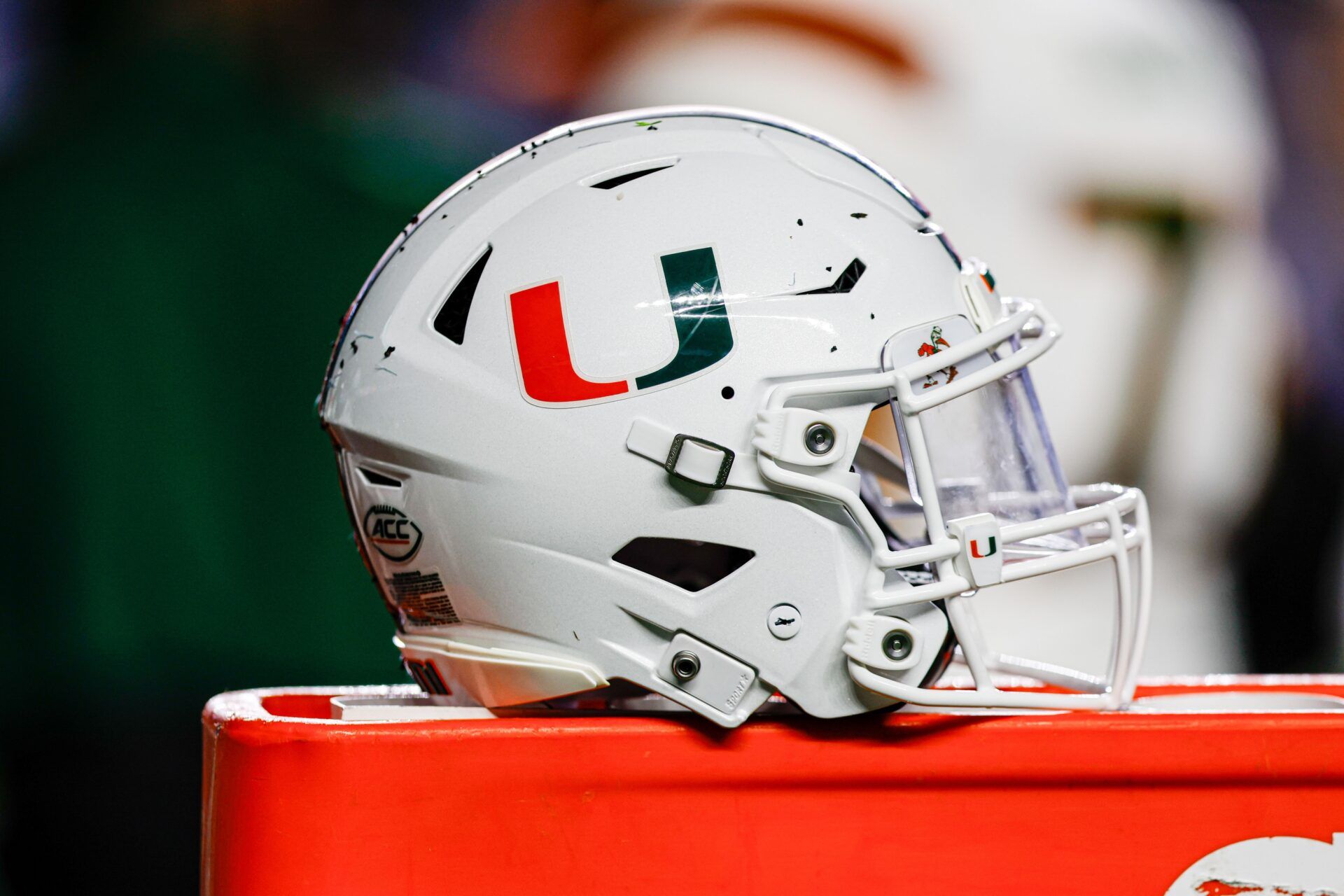 Miami Hurricanes helmet sits on bench as the Hurricanes play against the North Carolina Tar Heels at Kenan Memorial Stadium.