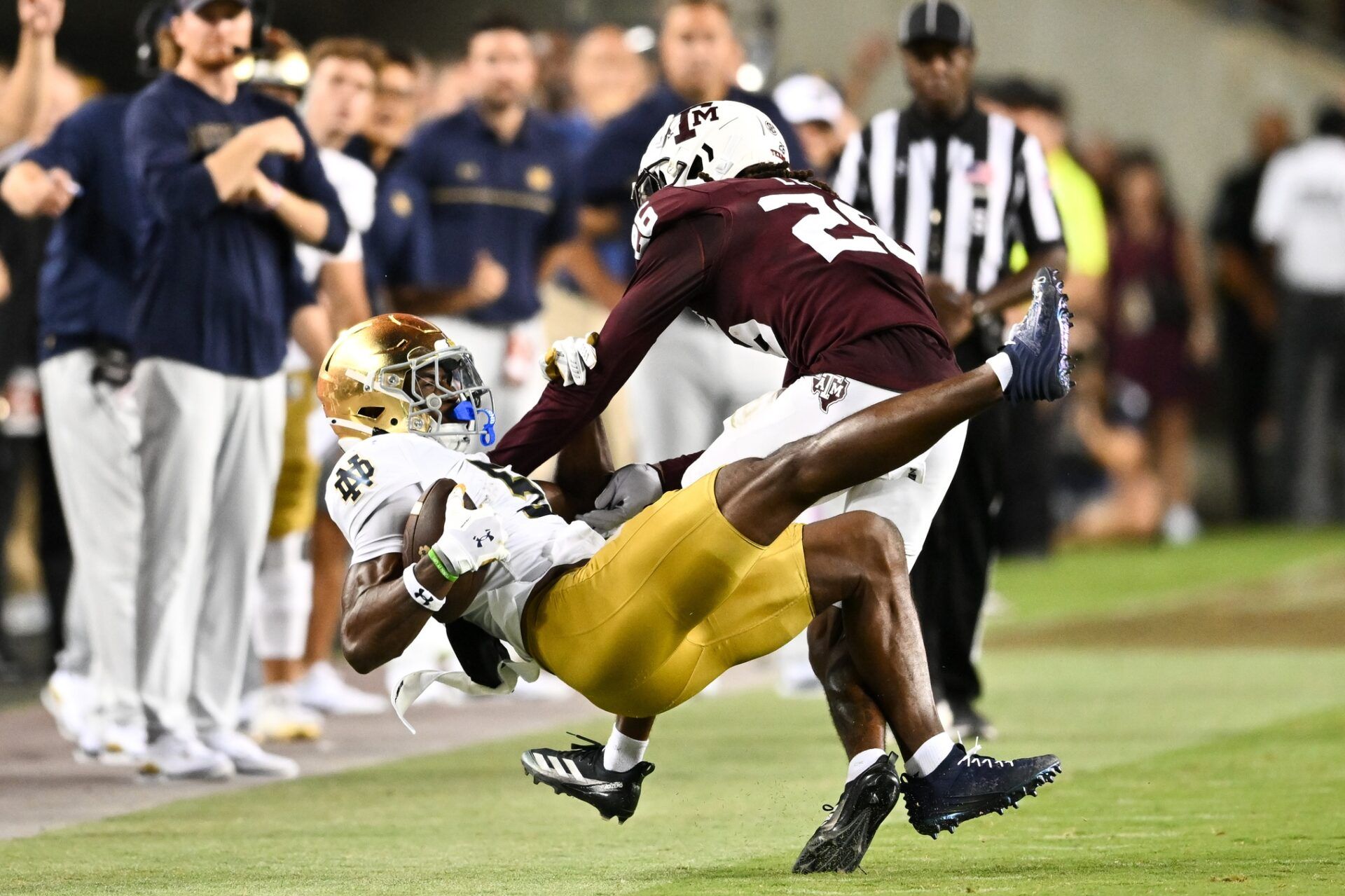 Notre Dame Fighting Irish wide receiver Beaux Collins (5) catches a pass as Texas A&M Aggies defensive back Dashawn Fillmore (26) attempts to break up the play in the fourth quarter at Kyle Field.