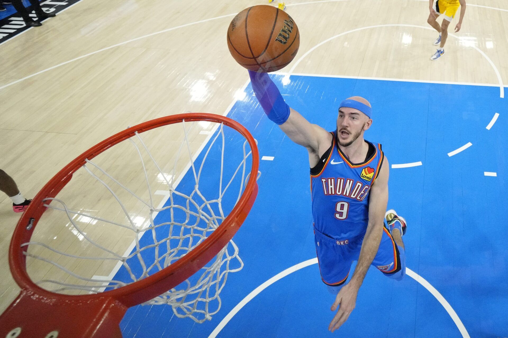 Oklahoma City Thunder guard Alex Caruso (9) dunks against the Indiana Pacers during the first half of game seven of the 2025 NBA Finals at Paycom Center.