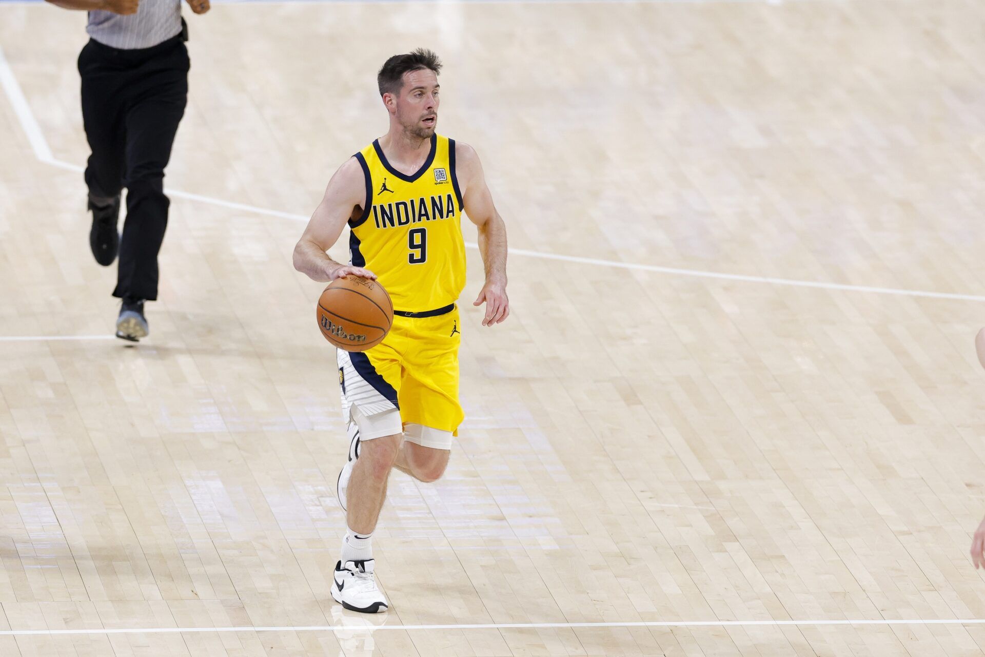Indiana Pacers guard T.J. McConnell (9) brings the ball up court against the Oklahoma City Thunder during the fourth quarter in game five of the 2025 NBA Finals at Paycom Center.