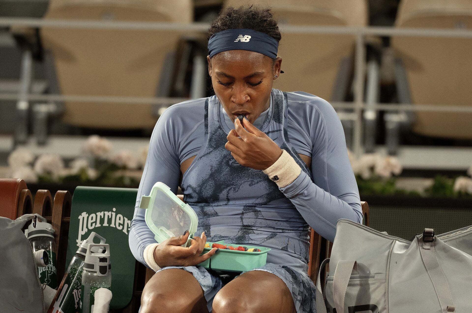 Coco Gauff of the United States eats some fruit at a change of ends during her match  against Madison Keys of the United States on day 11 at Roland Garros Stadium.