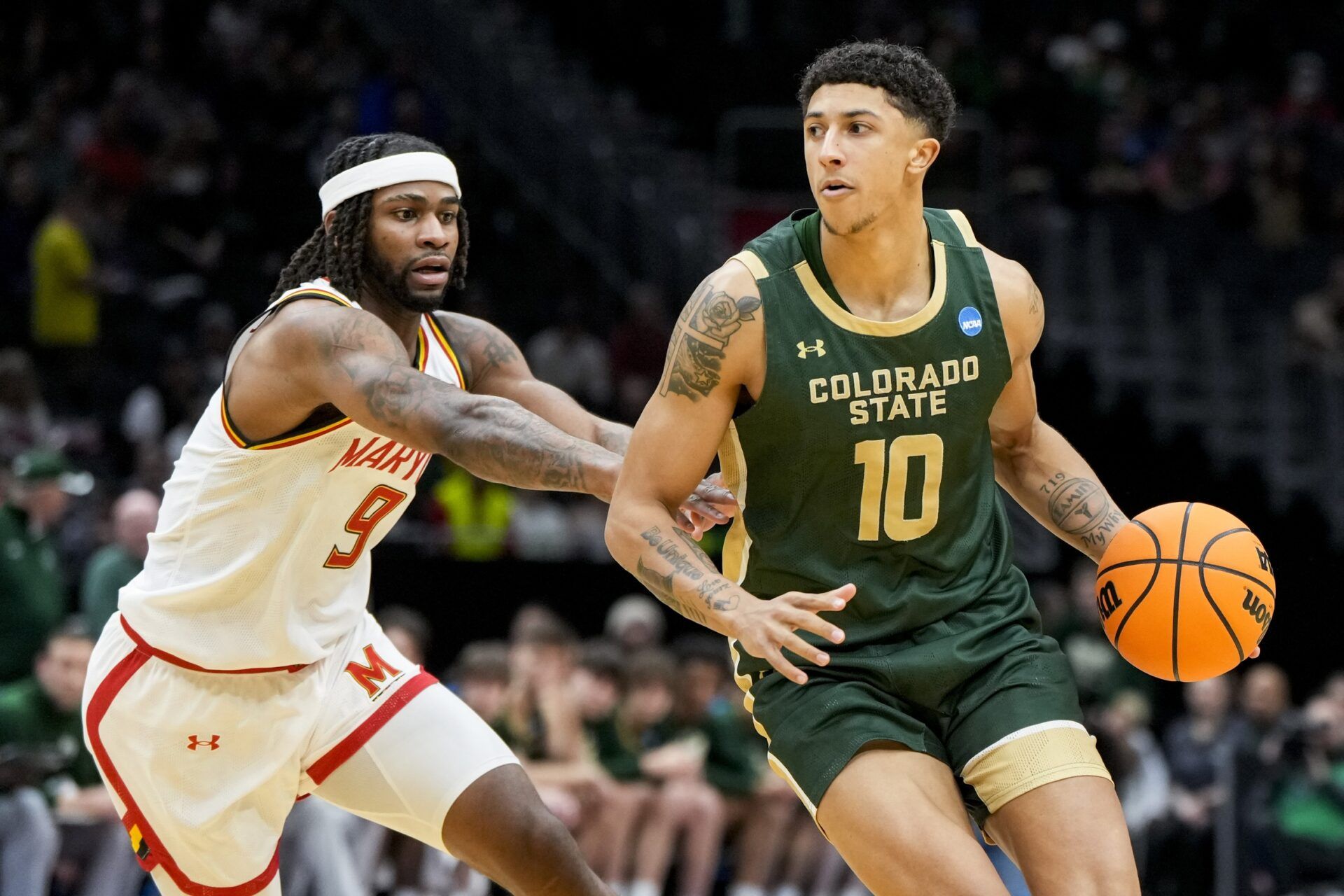 Maryland Terrapins guard Selton Miguel (9) defends against Colorado State Rams guard Nique Clifford (10) in the first half at Climate Pledge Arena.
