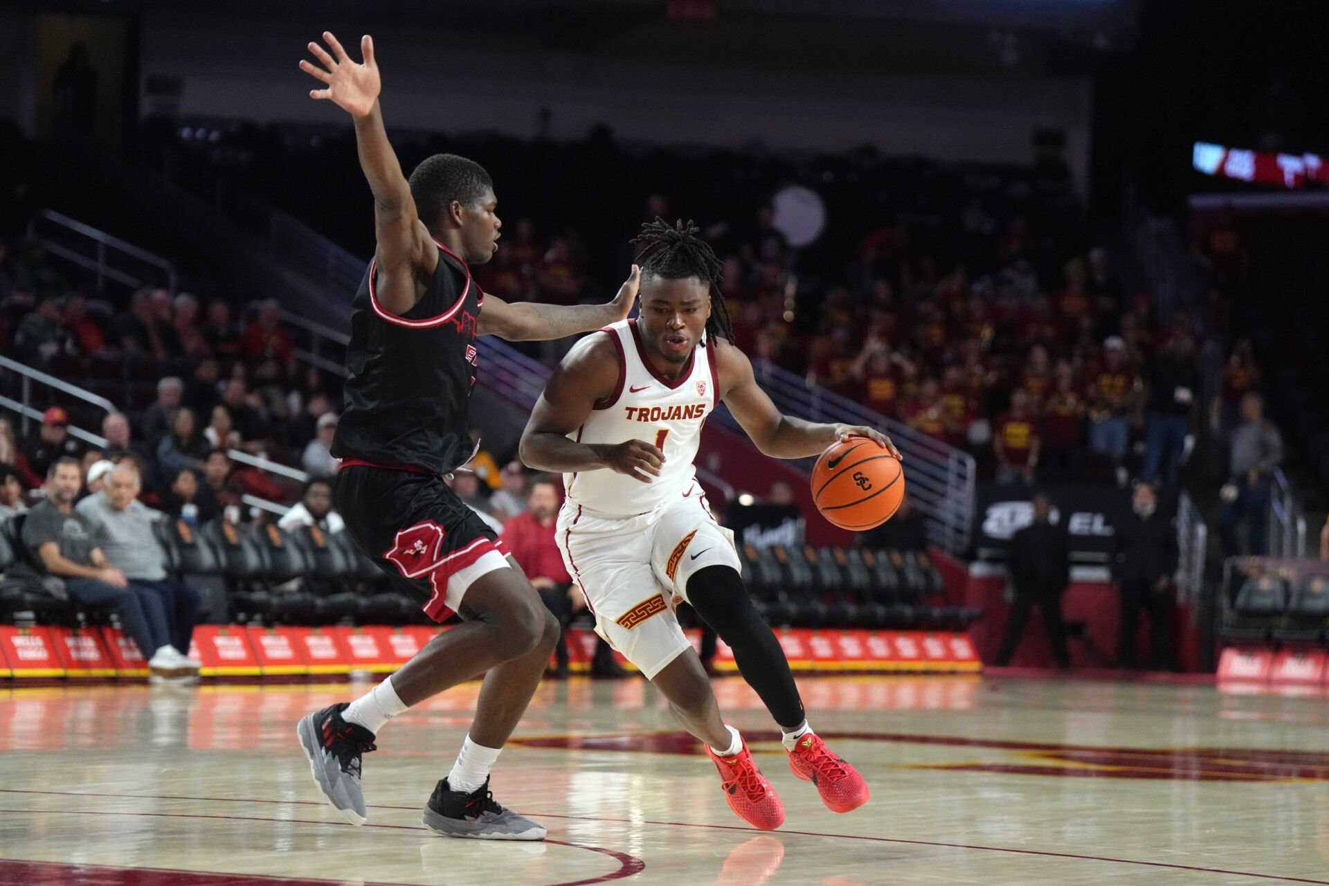 Nov 29, 2023; Los Angeles, California, USA Southern California Trojans guard Isaiah Collier (1) dribbles the ball against Eastern Washington Eagles forward Cedric Coward (0) at the Galen Center.