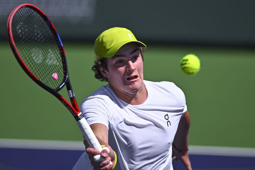 Joao Fonseca (BRA) hits a ball against Jack Draper (GBR) at Indian Well Tennis Garden.
