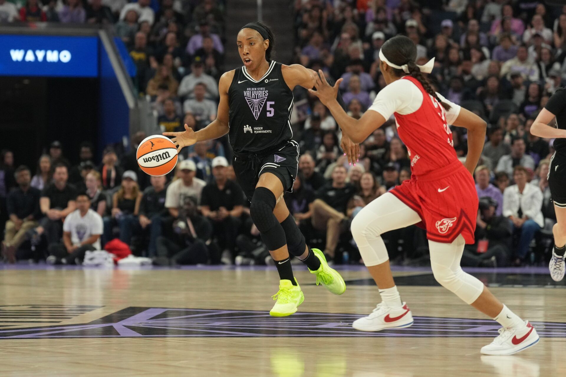 Golden State Valkyries forward Kayla Thornton (5) dribbles against Indiana Fever guard Sydney Colson (right) during the first quarter at Chase Center.