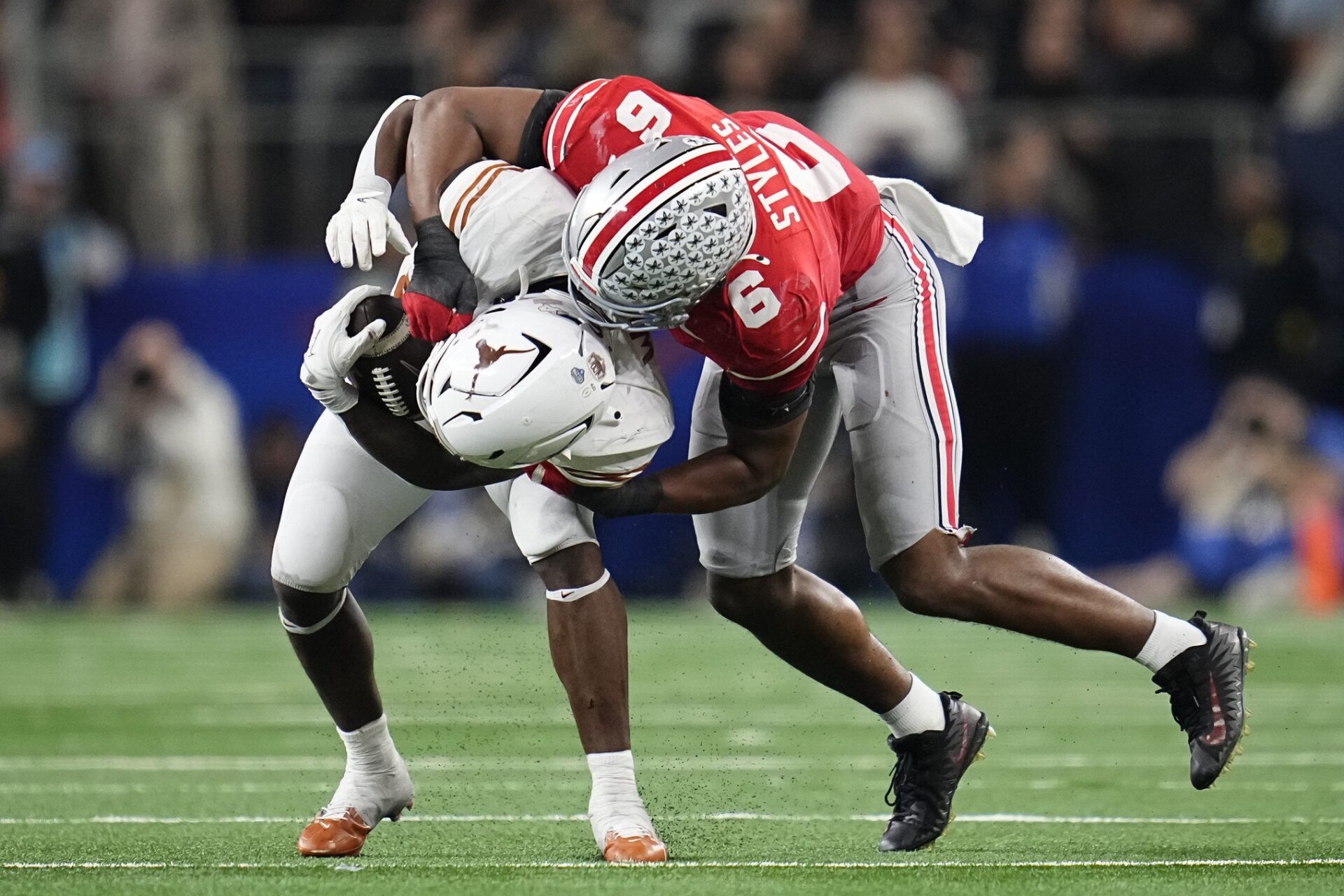 Ohio State Buckeyes safety Sonny Styles (6) tackles Texas Longhorns wide receiver Ryan Wingo (5) during the second half of the Cotton Bowl Classic College Football Playoff semifinal game at AT&T Stadium in Arlington, Texas on Jan. 10, 2025. Ohio State won 28-14.