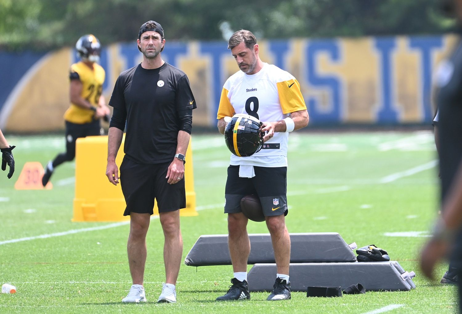 Pittsburgh Steelers quarterback Aaron Rodgers (8) puts on his helmet during minicamp at their South Side facility.