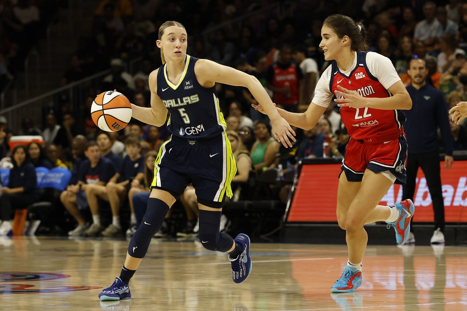Dallas Wings guard Paige Bueckers (5) dribbles the ball as Washington Mystics guard Sonia Citron (22) defends in the first half at Entertainment & Sports Arena.