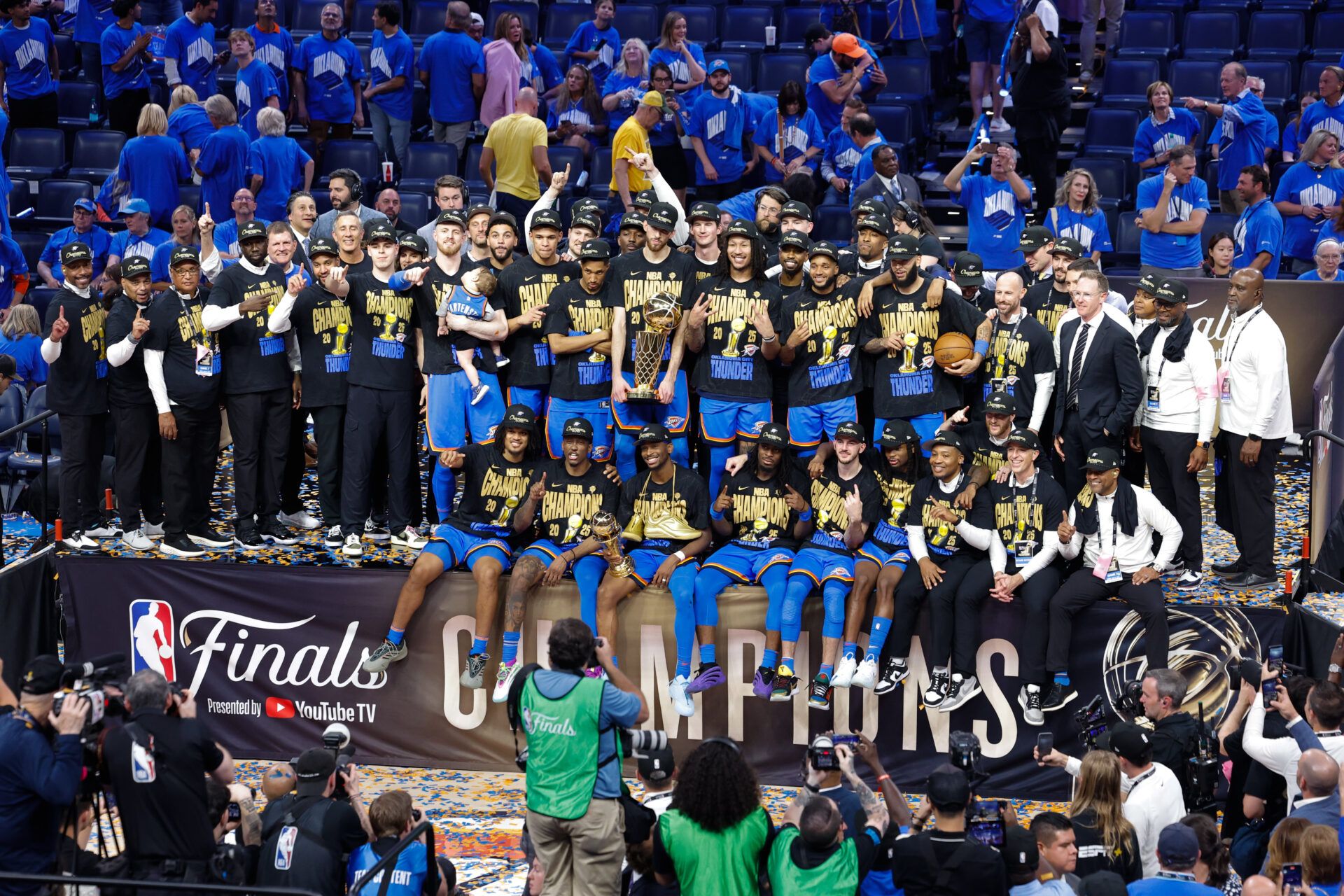 The Oklahoma City Thunder pose for a team photo with the Larry O'Brien Championship Trophy as they celebrate after winning game seven of the 2025 NBA Finals against the Indiana Pacers at Paycom Center.